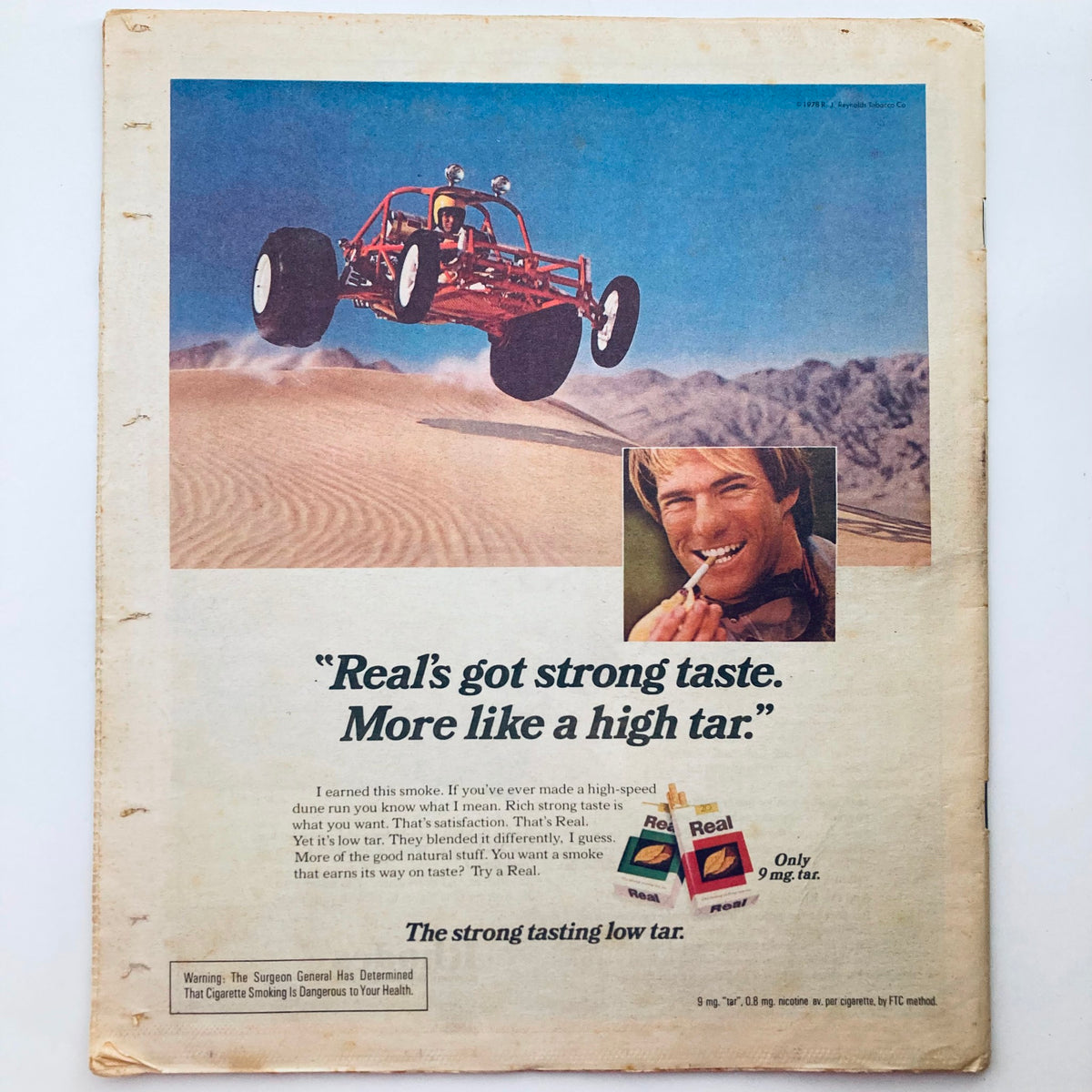 Back cover of Rolling Stone Magazine June 1, 1978 Issue 266 advertising Real cigarettes with a vibrant image of a dune buggy and a smiling man.