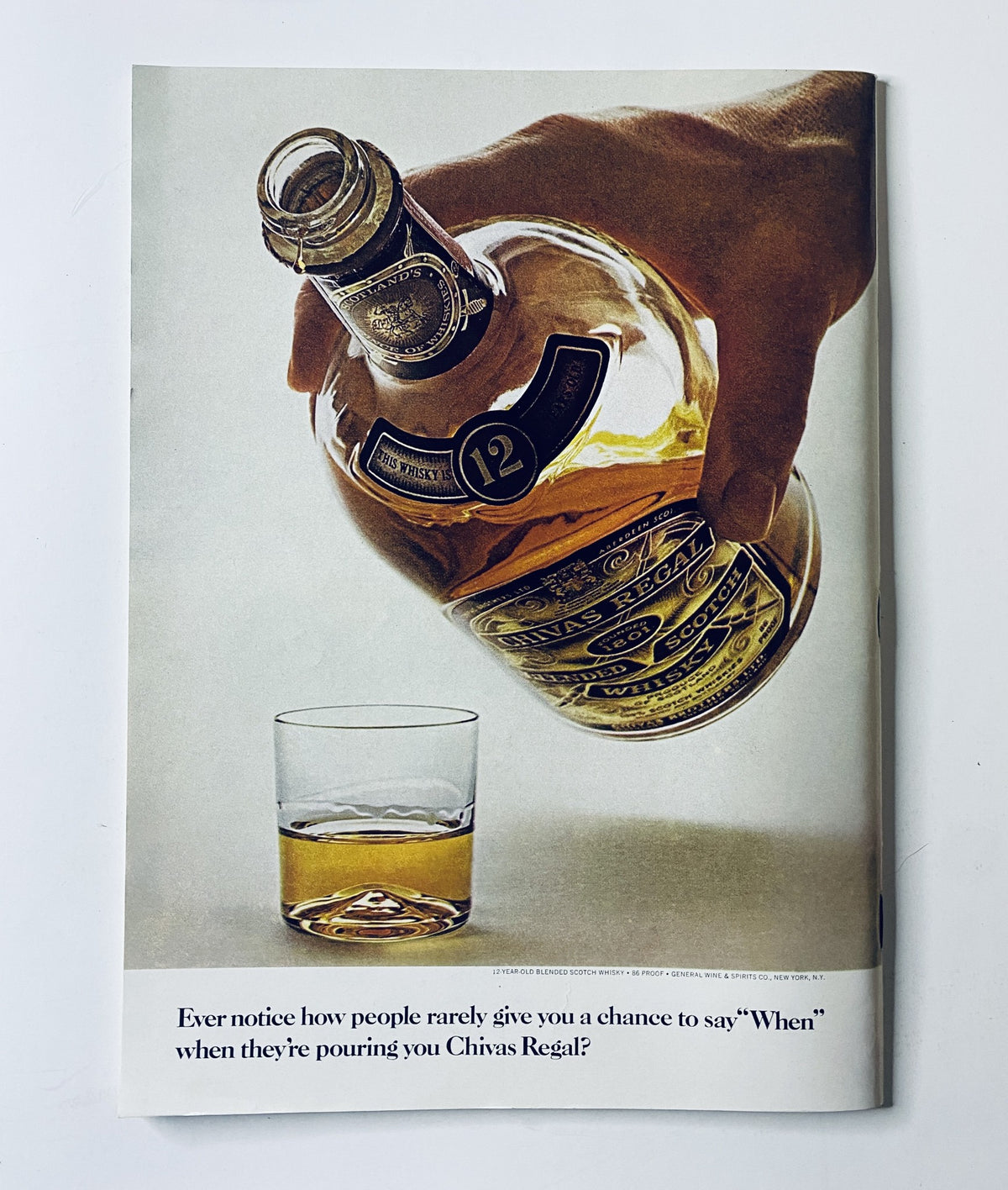 Advertisement from The New Yorker Magazine June 21, 1969, displaying a bottle of Chivas Regal being poured into a glass, highlighting the whiskey brand.