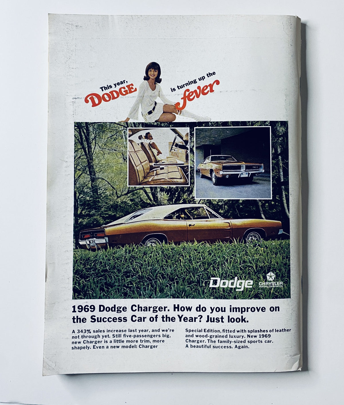 Advertisement for the 1969 Dodge Charger featured in The New Yorker Magazine October 26, 1968, highlighting its luxury and performance.