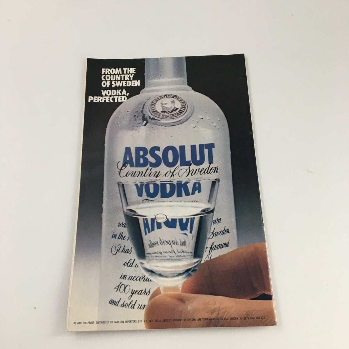 Cover of the Absolut Vodka advertisement featuring the tagline 'From the country of Sweden, vodka perfected,' highlighting the iconic bottle design.