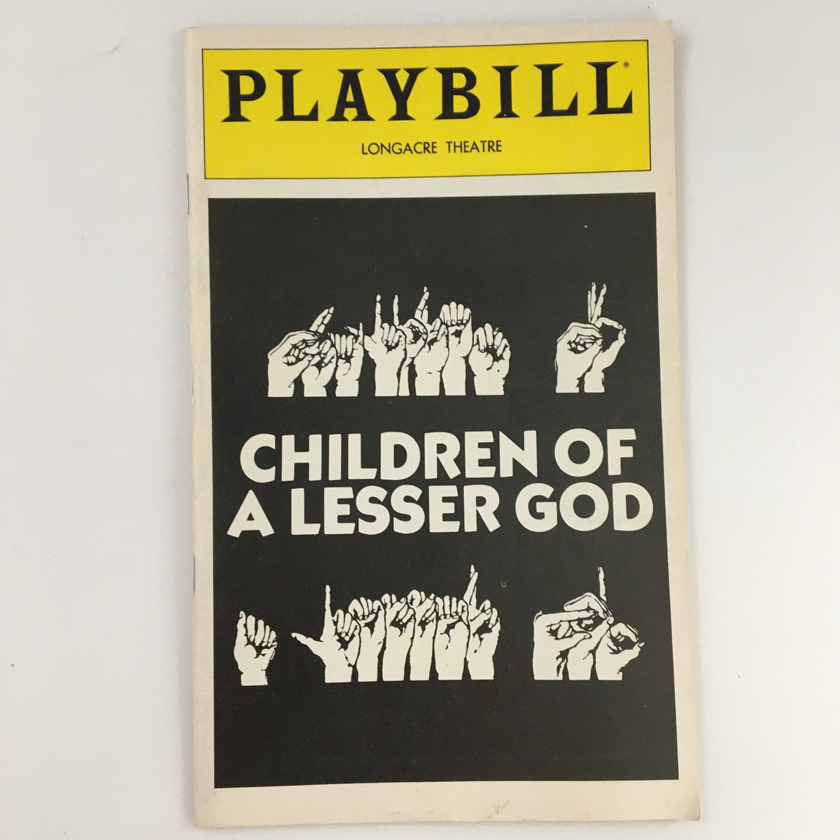 1980 Playbill for 'Children of a Lesser God' at Longacre Theatre featuring illustrations of hands in sign language.