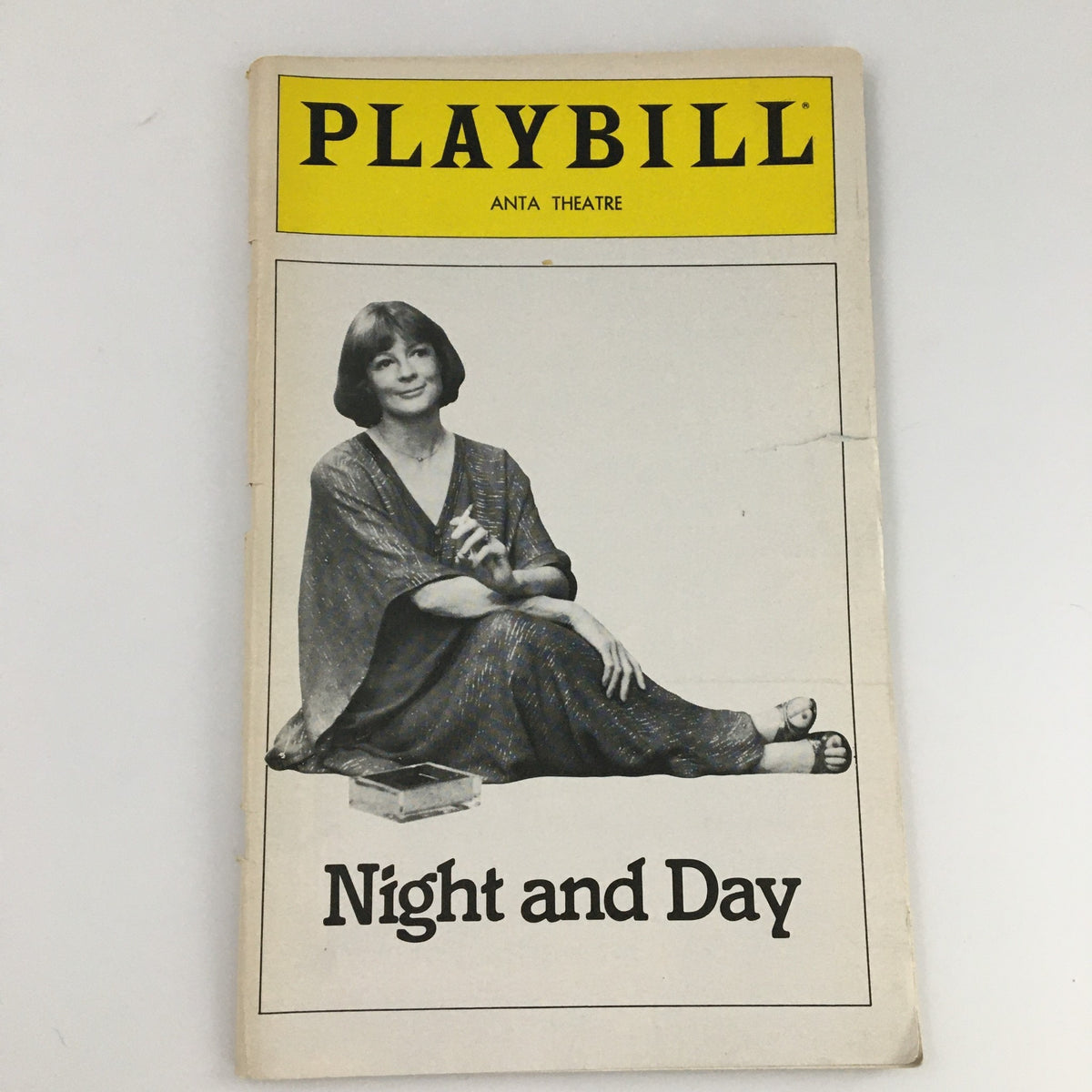 Cover of the 1980 Playbill for 'Night and Day' at Anta Theatre, featuring an image of a female actor seated elegantly with a dramatic expression.