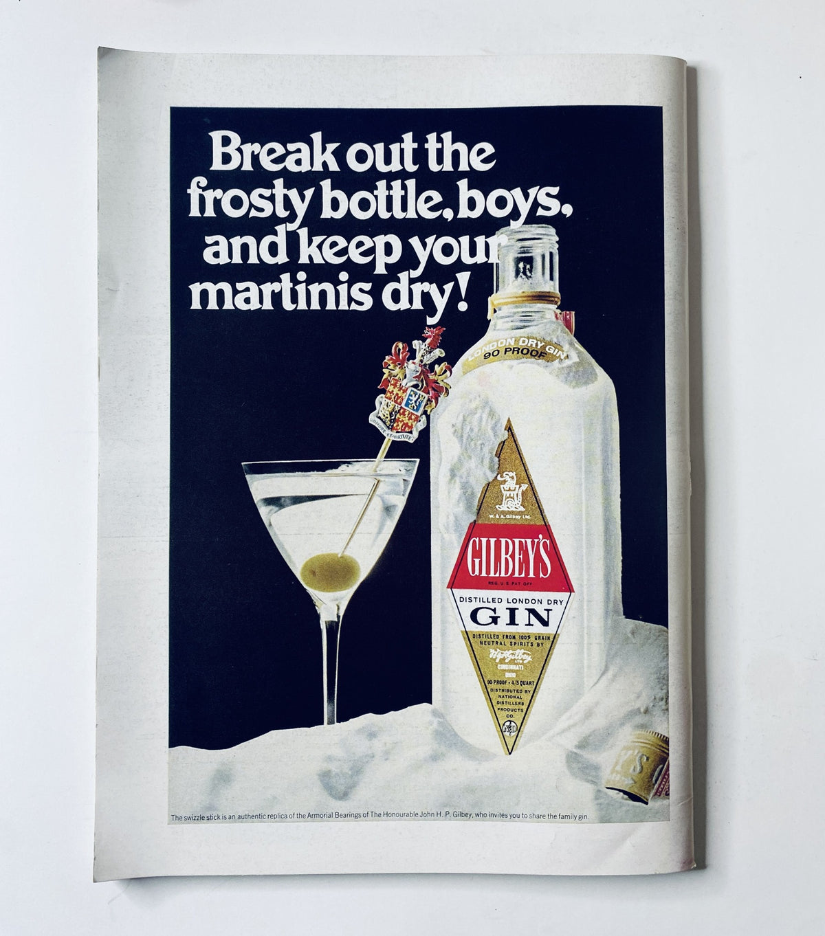 Vintage advertisement for Gilbey's gin featuring a frosty bottle and a martini glass, promoting the message 'Break out the frosty bottle, boys, and keep your martinis dry!' from The New Yorker Magazine March 29, 1969.