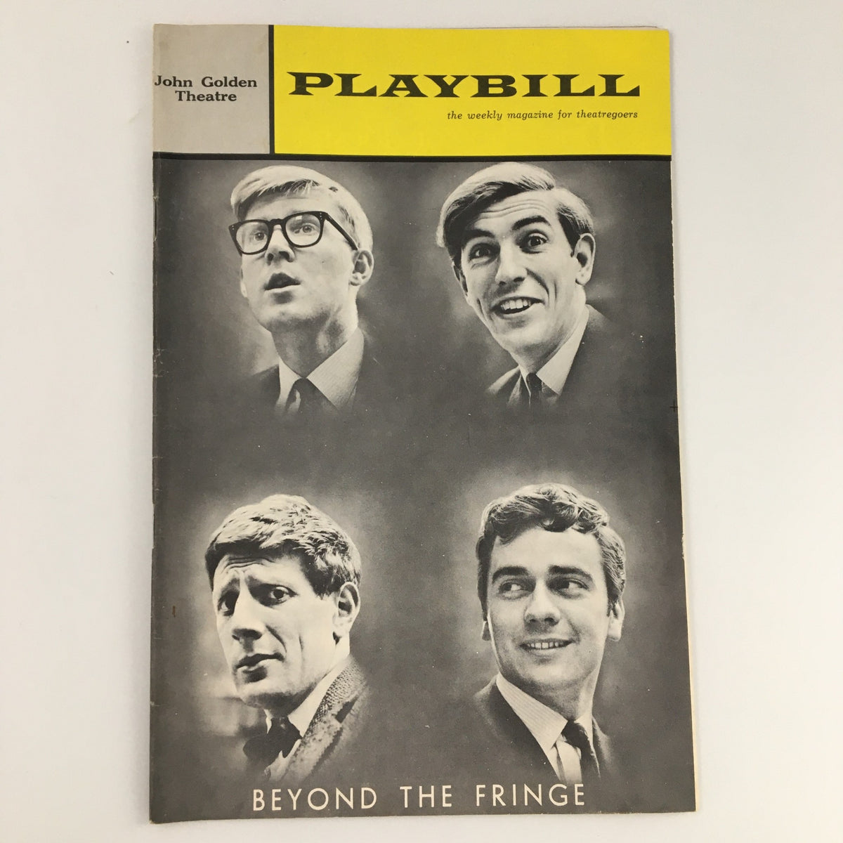 1963 Playbill for 'Beyond the Fringe' featuring prominent British comedians Alan Bennett and Peter Cook on the cover, showcasing a vintage design from the John Golden Theatre.