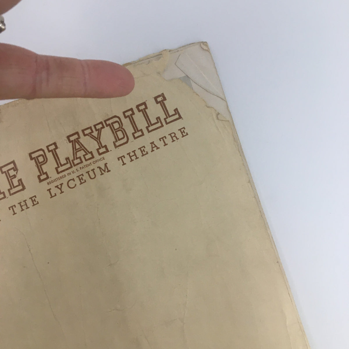 Another angle of the 1947 Playbill for the Lyceum Theatre 'Born Yesterday', focusing on the cover imperfections and historical significance.