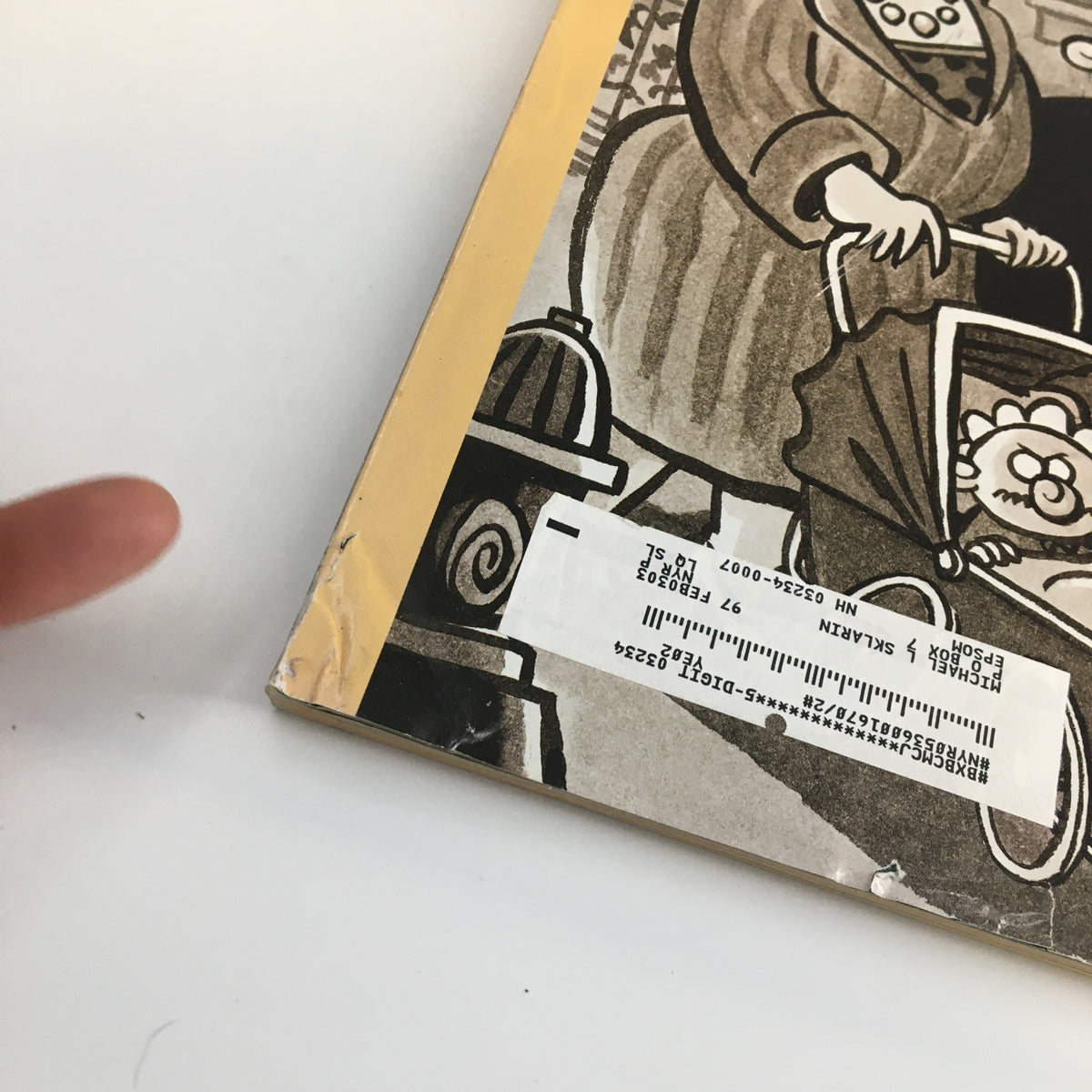 Close-up view of the edge of The New Yorker Full Magazine June 17 2002 highlighting a small rip and an address label, adding character to the vintage publication.