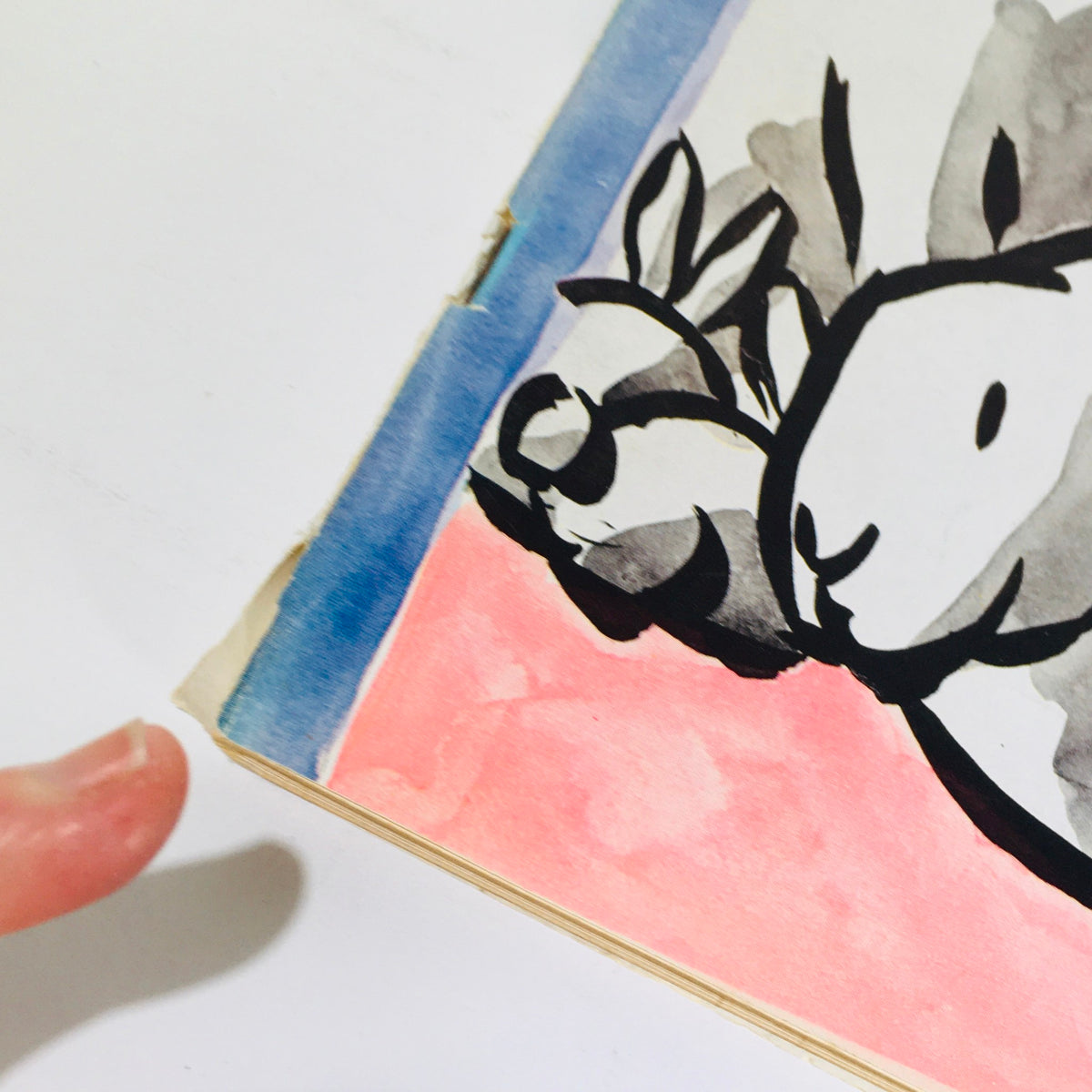 Close-up of the edge of The New Yorker April 17 1965 magazine cover featuring a playful artistic illustration and visible signs of wear, suitable for collectors.