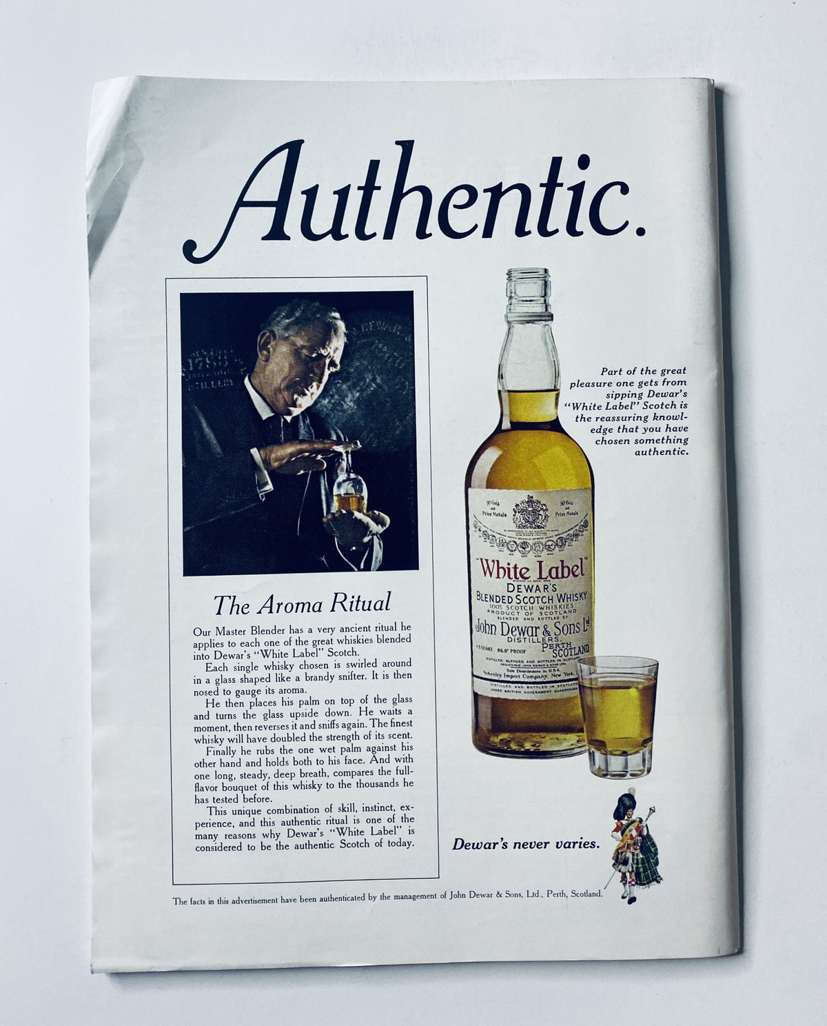 The New Yorker Magazine September 16, 1972 Two Men in Barrels A. François advertisement for Dewar's White Label whisky, showcasing an amber-filled glass and the tagline 'Authentic.' This vintage ad highlights the brand's heritage and craftsmanship.