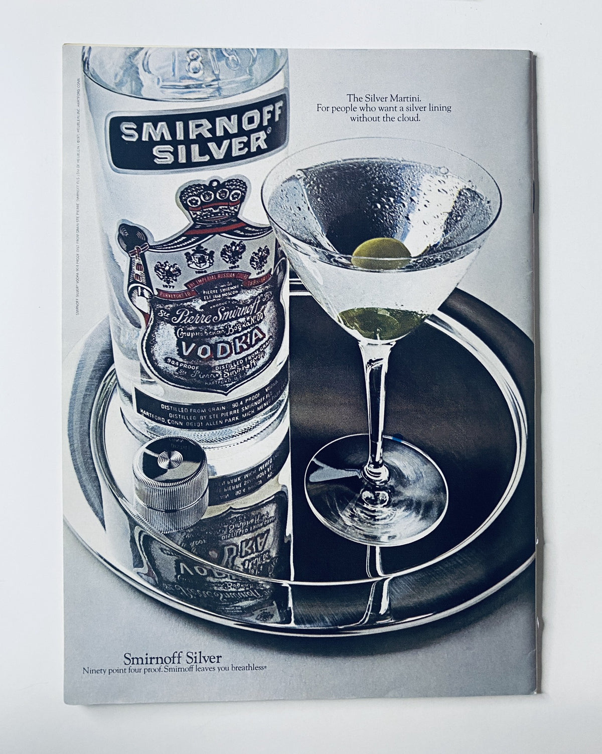 Advertisement for Smirnoff Silver vodka featuring a martini glass on a silver tray, from an issue of The New Yorker Magazine.