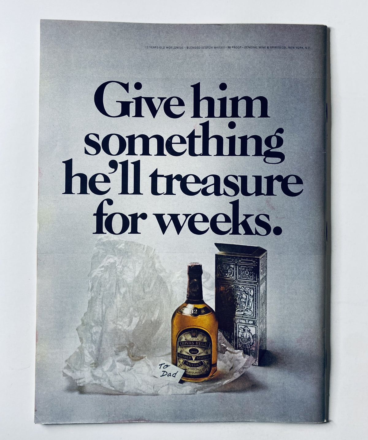 Advertisement page from The New Yorker Magazine June 16, 1973, promoting a gift idea with a bottle of liquor, captioned 'Give him something he’ll treasure for weeks.'
