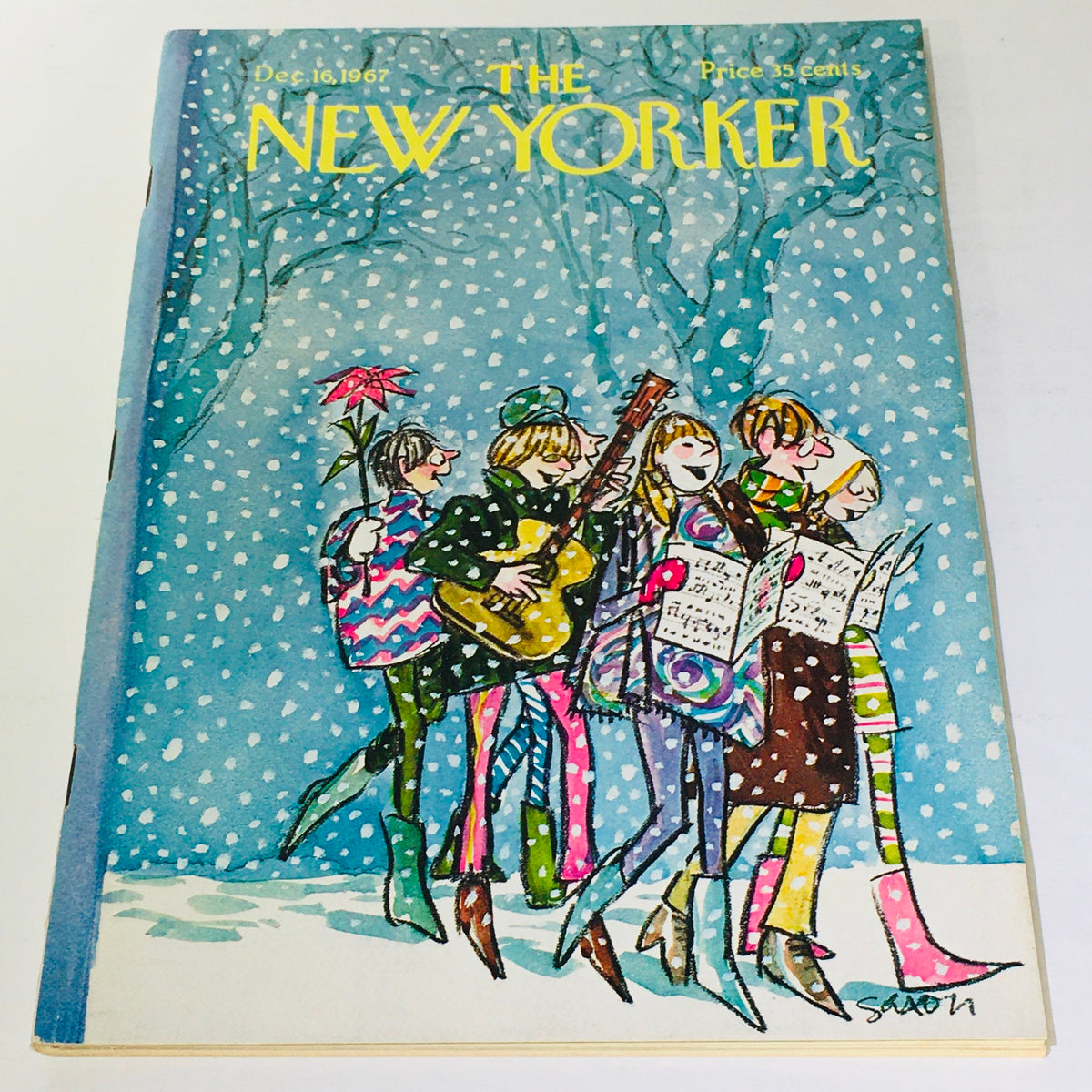 Cover of The New Yorker magazine from December 16, 1967 featuring colorful illustration by Charles Saxon, depicting a cheerful group of carolers in a snowy landscape.