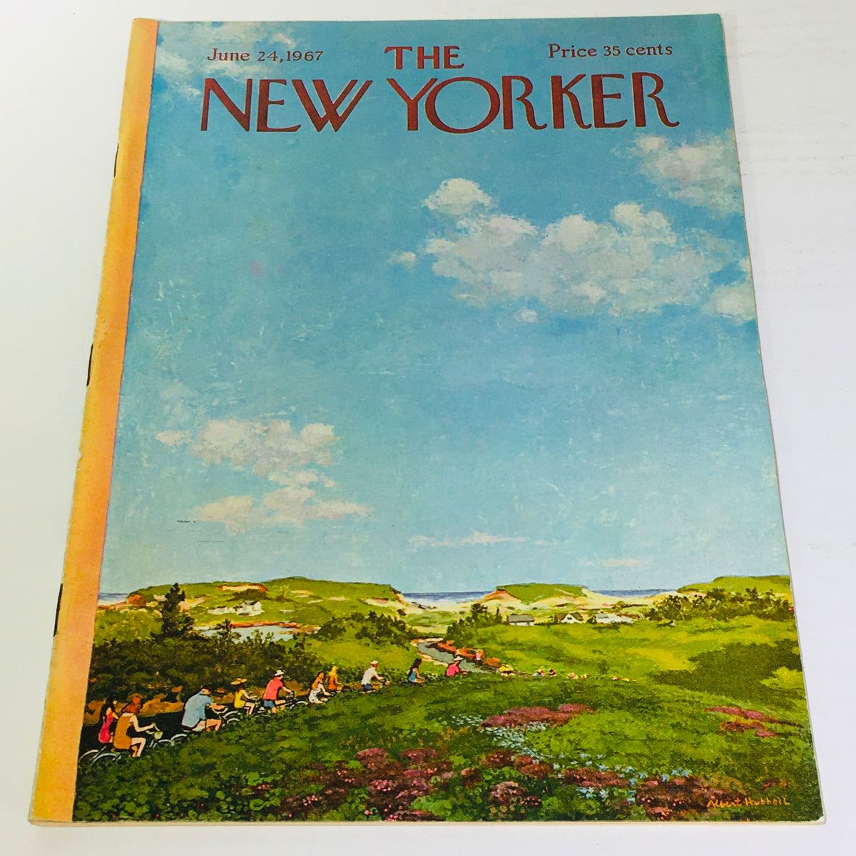 Cover of The New Yorker magazine from June 24, 1967, featuring vibrant artwork by Albert Hubbell depicting a scenic landscape with people biking in a lush green setting and blue skies.