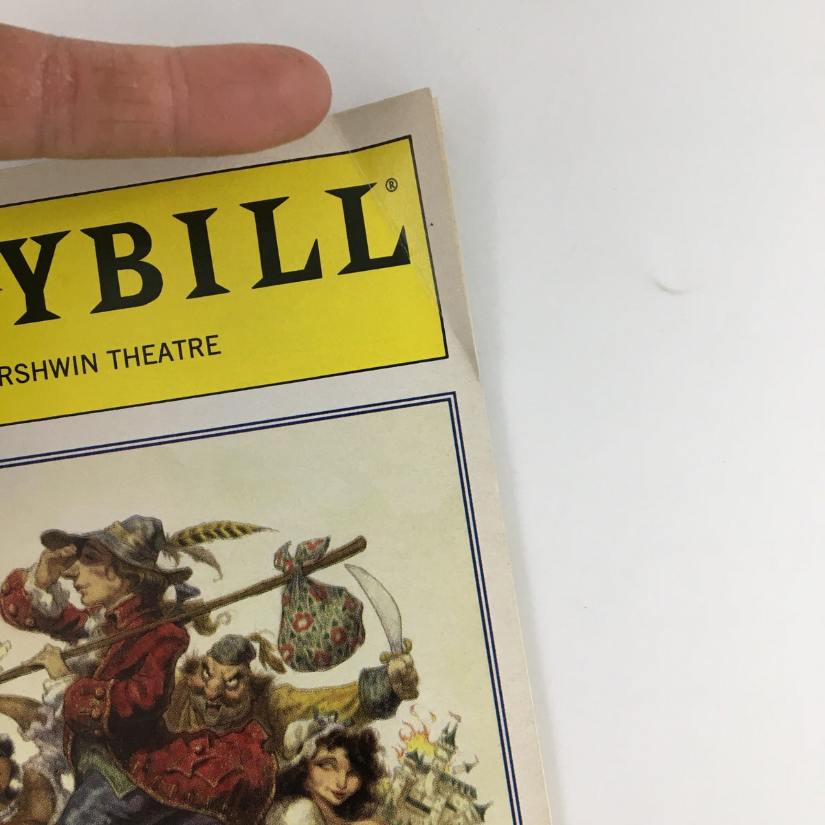 Close-up of the 1997 Playbill for 'Candide' showing the title and theatrical details.