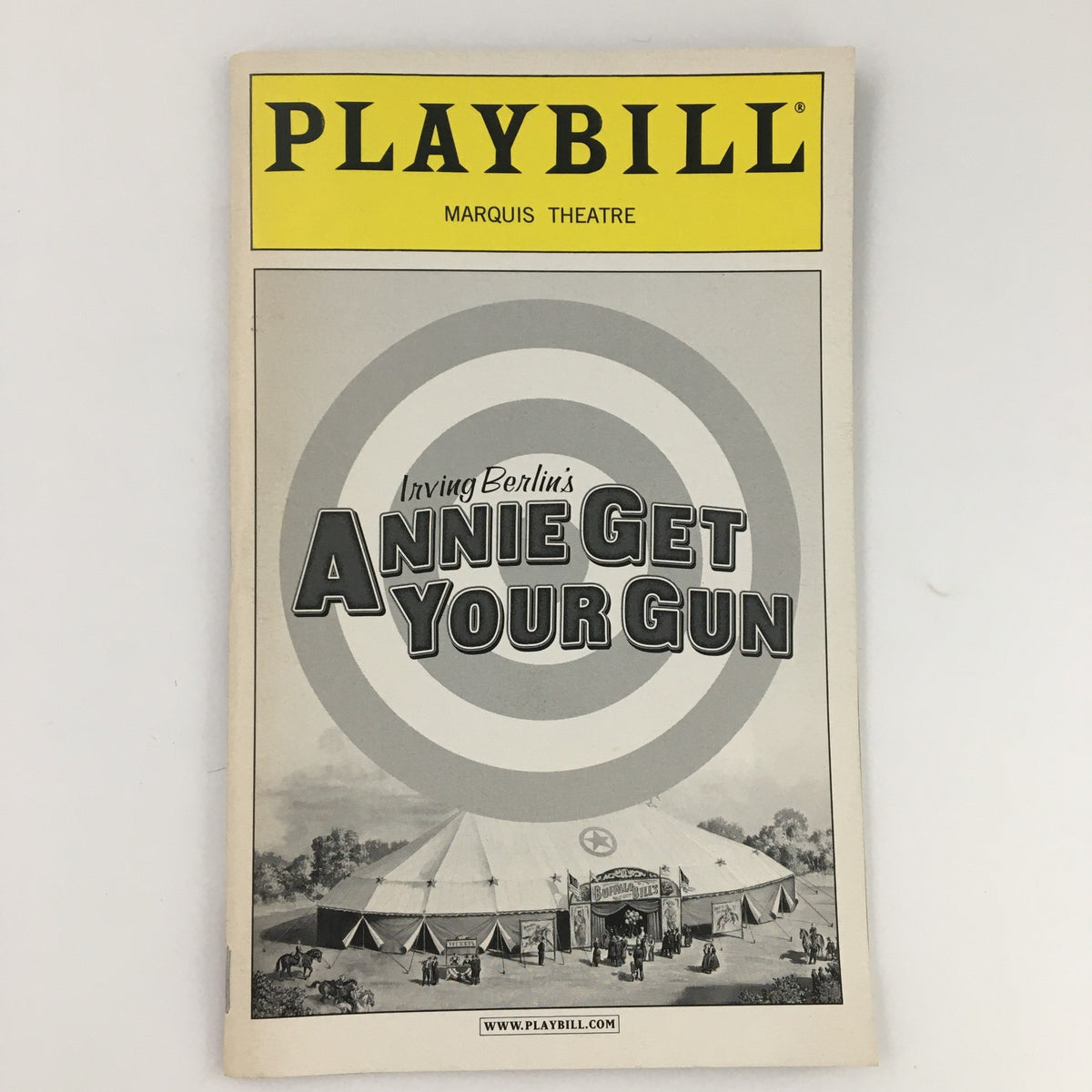 2001 Playbill for Annie Get Your Gun at Marquis Theatre, featuring classic design with a target and circus tent illustration.