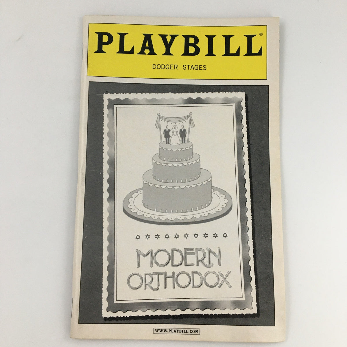 2005 Playbill for Dodger Stages featuring 'Modern Orthodox', an engaging play by John Cariani with a decorative cover showcasing a wedding cake design.