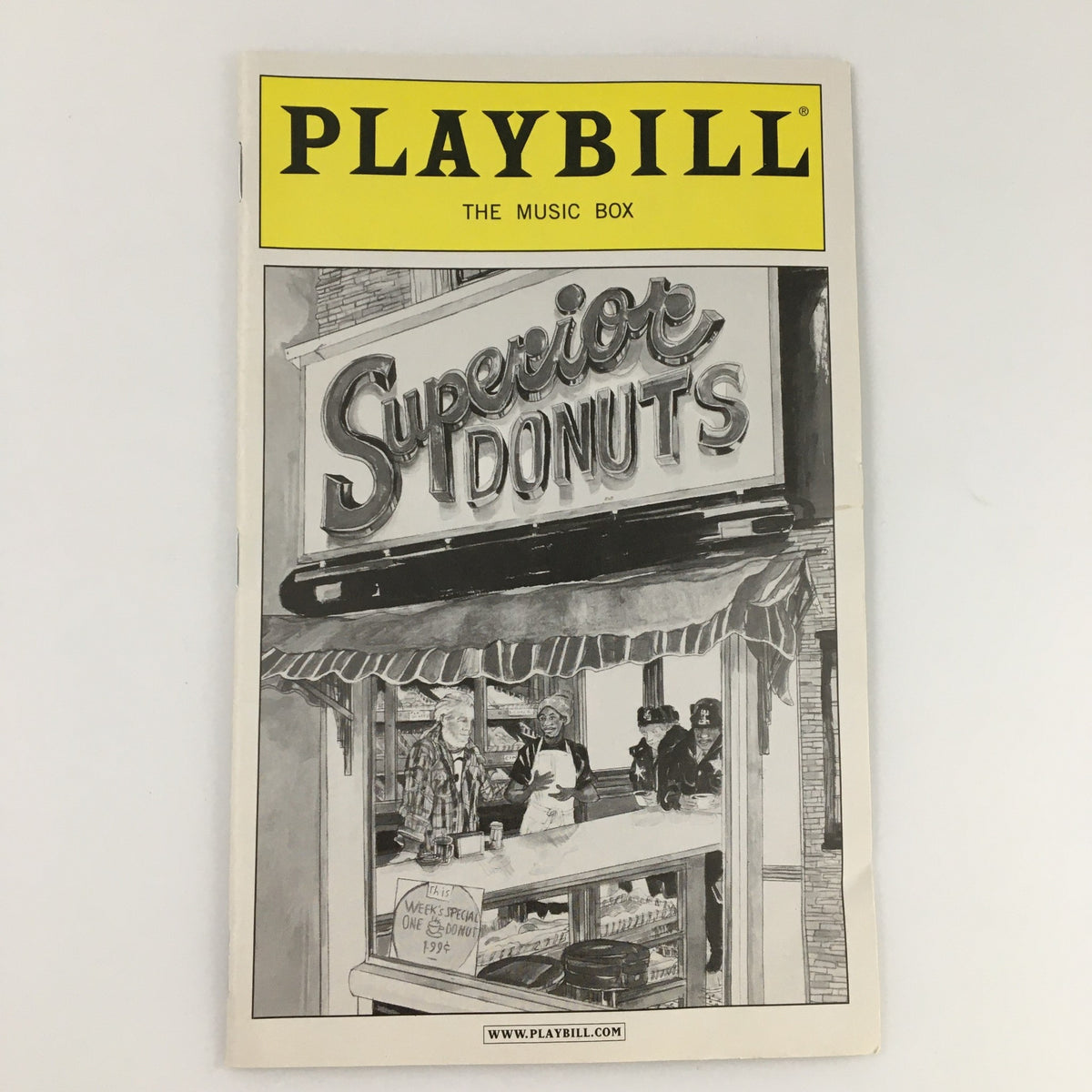 Cover of the 2009 Playbill for The Music Box 'Superior Donuts' featuring a detailed illustration of the theater's sign.