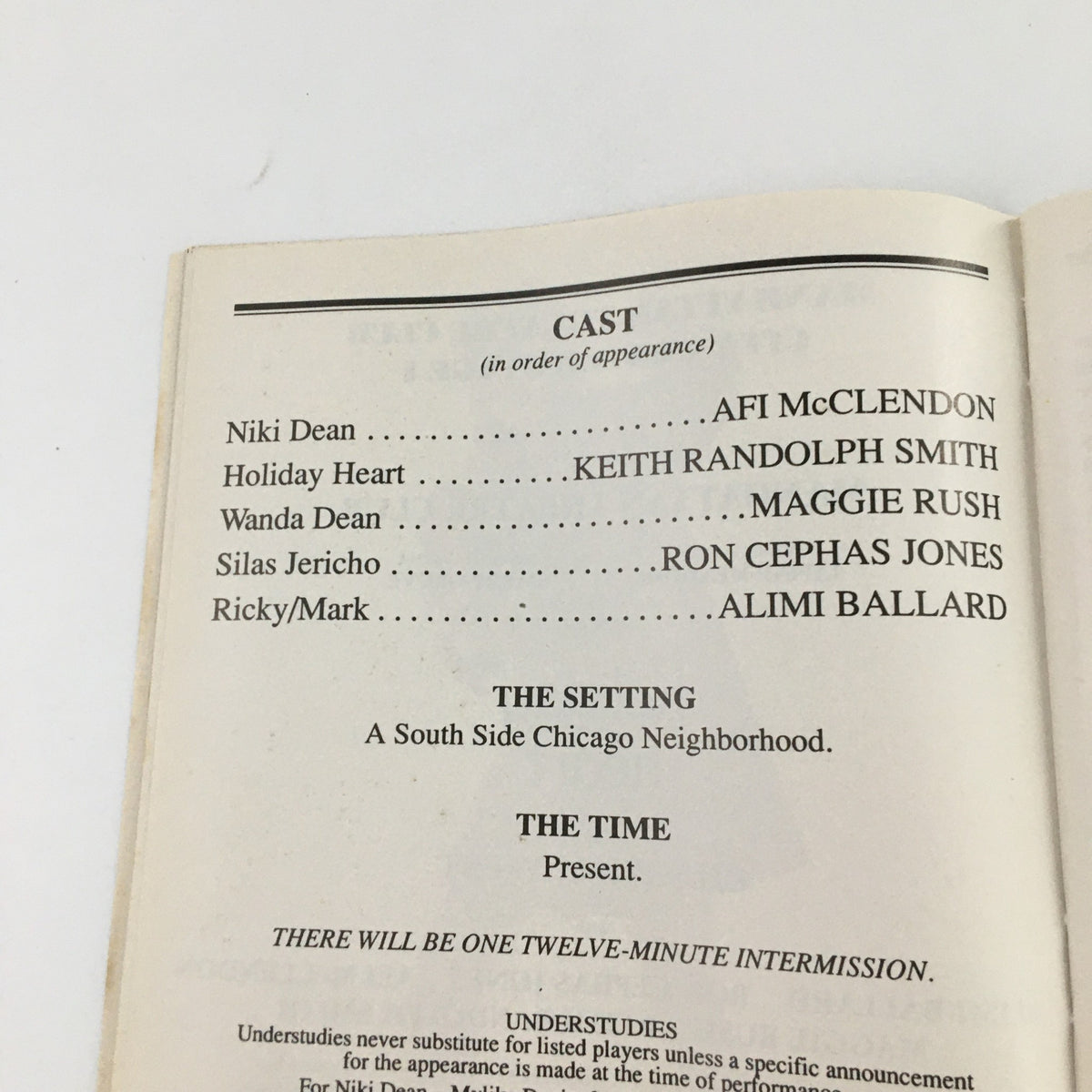 Cast list from the 1995 Playbill for 'Holiday Heart', featuring character roles and actors, including Keith Randolph Smith and Maggie Rush.