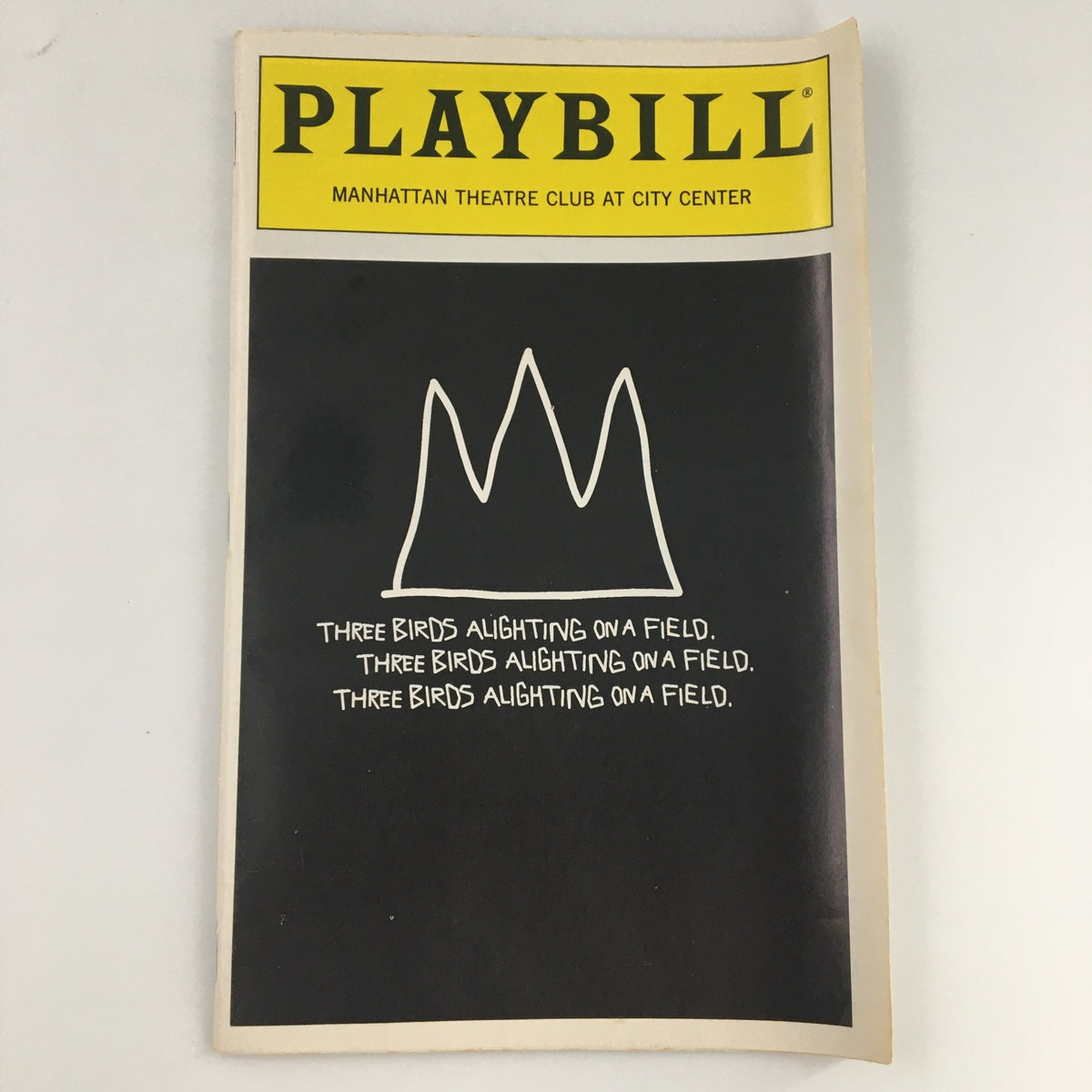 '94 Playbill from Manhattan Theatre Club production of Three Birds Alighting On A Field featuring a minimalist crown design on the cover.