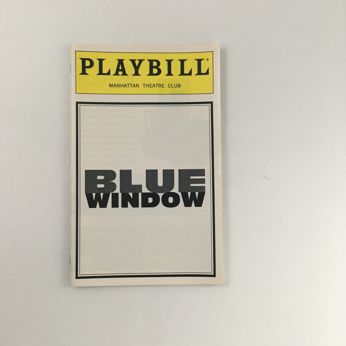 1996 Playbill for 'Blue Window' from Manhattan Theatre Club, showcasing the front cover with bold black text and yellow header.