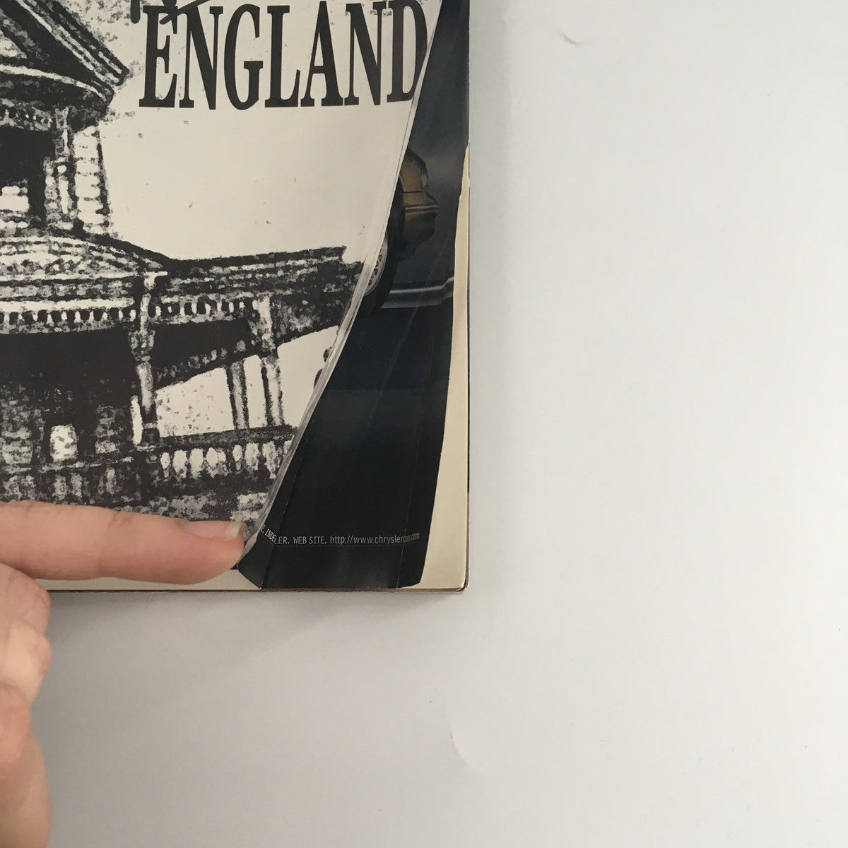 Close-up view of the 1995 Playbill 'New England' showing details of the cover and minor wear.
