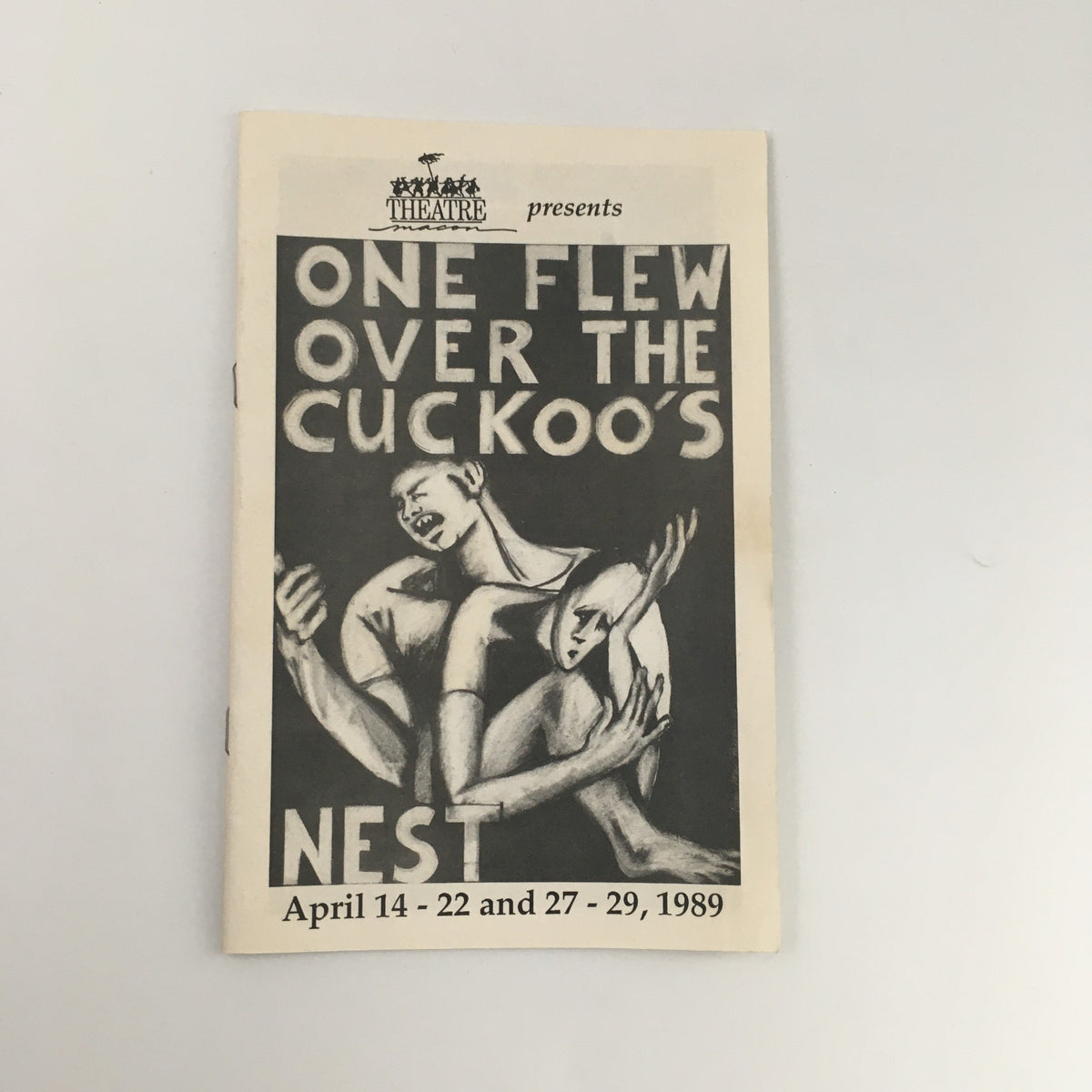 Cover of the 1989 Theatre magazine featuring 'One Flew Over The Cuckoo's Nest', showcasing striking artwork and details of the performance dates: April 14-22 and 27-29, 1989.
