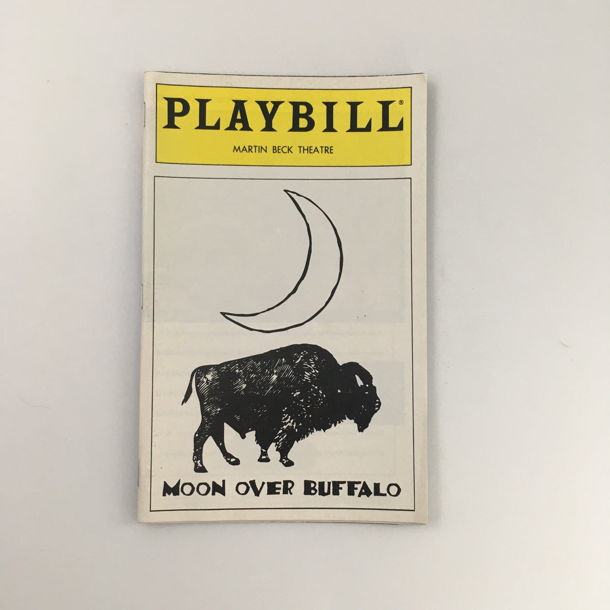1995 Playbill for 'Moon Over Buffalo' at the Martin Beck Theatre featuring a black and white illustration of a bison and a crescent moon.