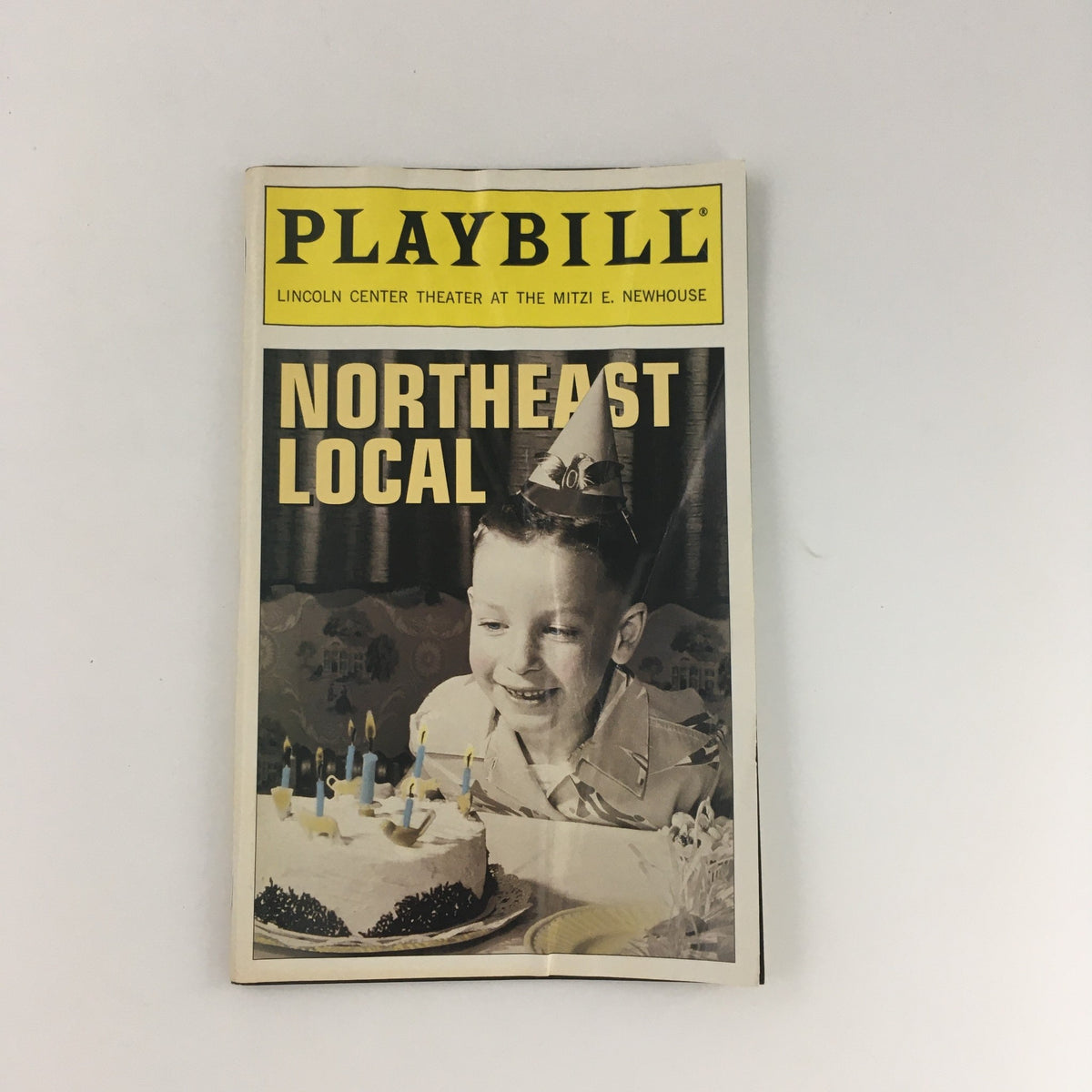 1995 Playbill Lincoln Center Theater 'Northeast Local' featuring a young boy celebrating with a birthday cake and candles.