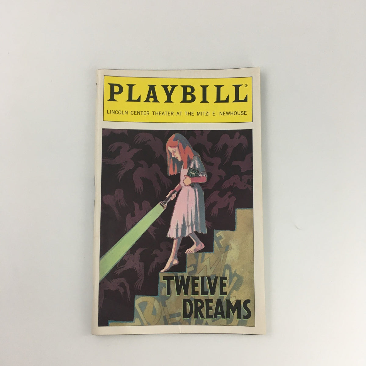1995 Playbill for 'Twelve Dreams' at the Mitzi E. Newhouse Theater featuring a stylized cover illustration.