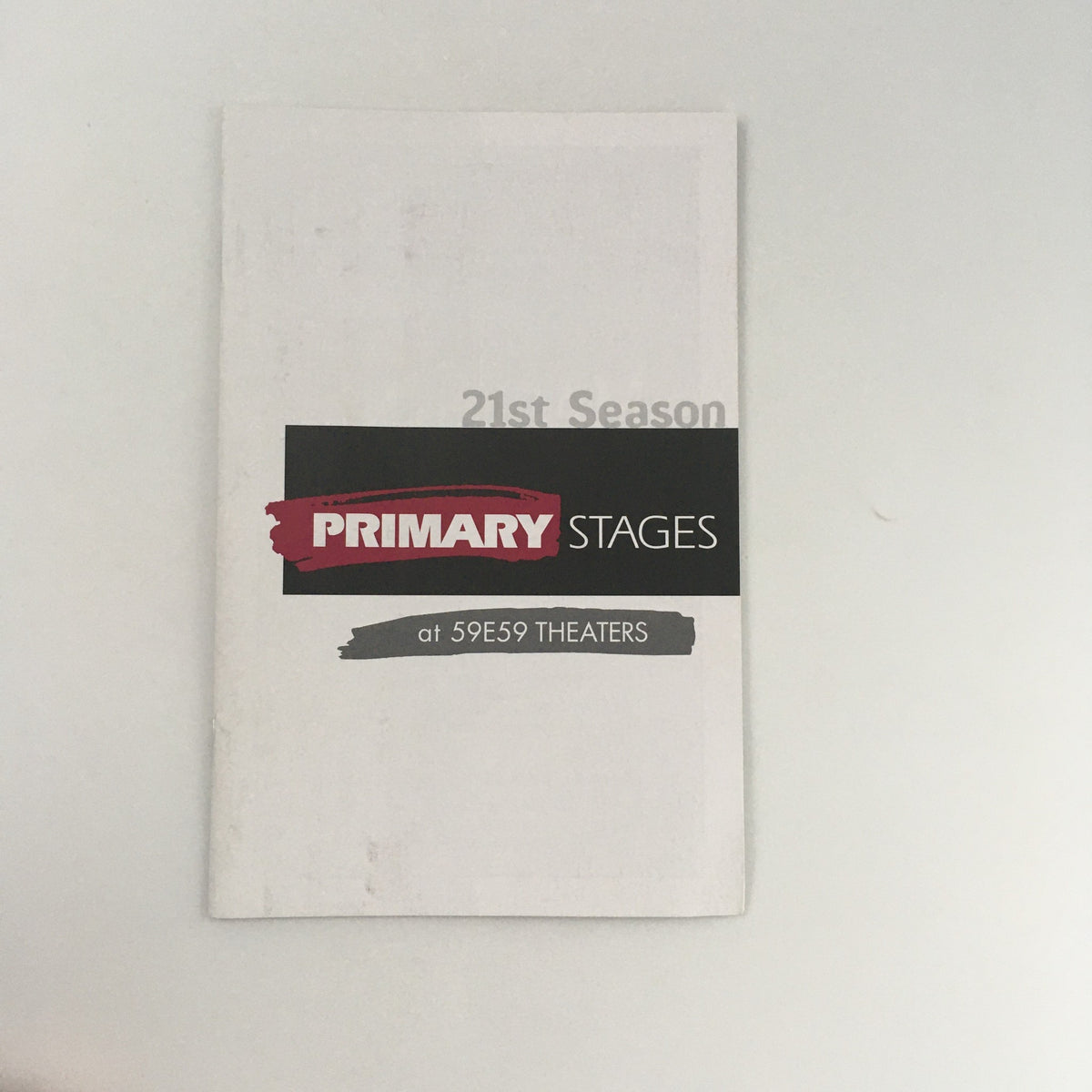 Cover of the program for the 21st Season at 59E59 Theaters, featuring 'Dedication of The Stuff of Dreams' Play by Terrence McNally.