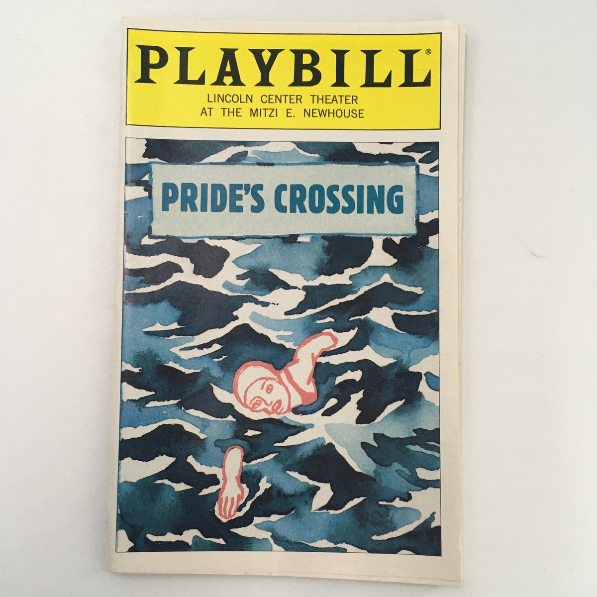 1997 Playbill for 'Pride's Crossing' at the Lincoln Center Theater, showcasing a cover illustration of a figure in water with a striking blue and white color scheme.
