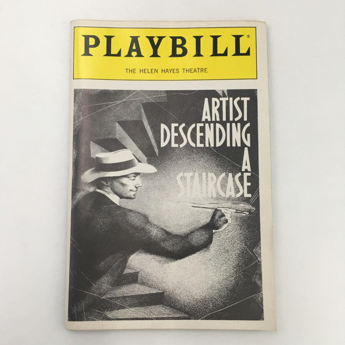 Cover of the 1989 Playbill for 'Artist Descending A Staircase' at the Helen Hayes Theatre featuring a stylized image of a man with a paintbrush.