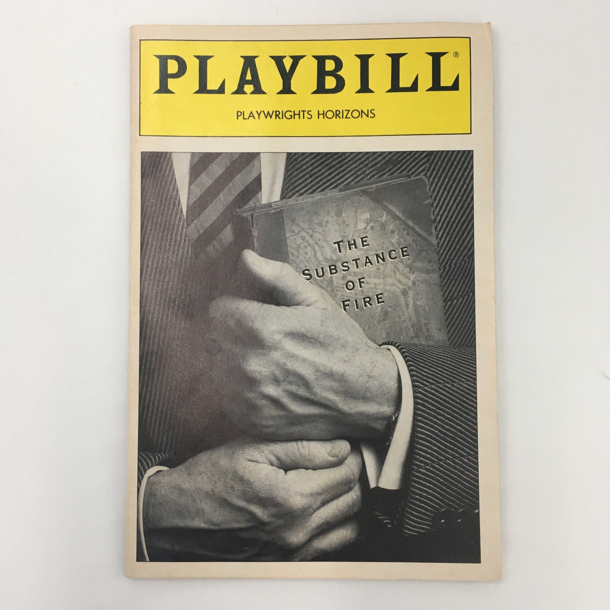 1991 Playbill for 'The Substance of Fire' featuring a close-up of hands holding the Playbill, emphasizing the title and production details at Playwrights Horizons.