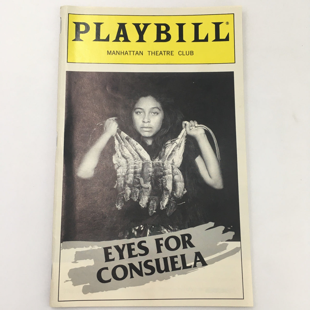 1998 Playbill for 'Eyes For Consuela' featuring a dramatic cover image with a woman holding a unique prop, representing the Manhattan Theatre Club production.