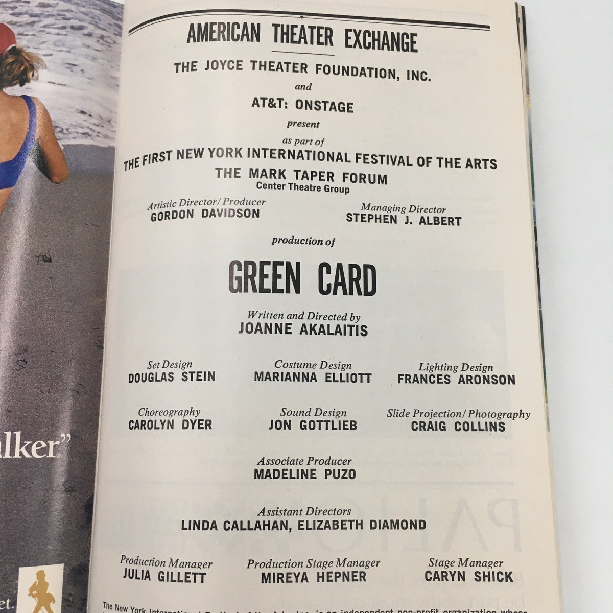 Page from the Playbill detailing the production team for 'Green Card', highlighting the work of Joanne Akalaitis.