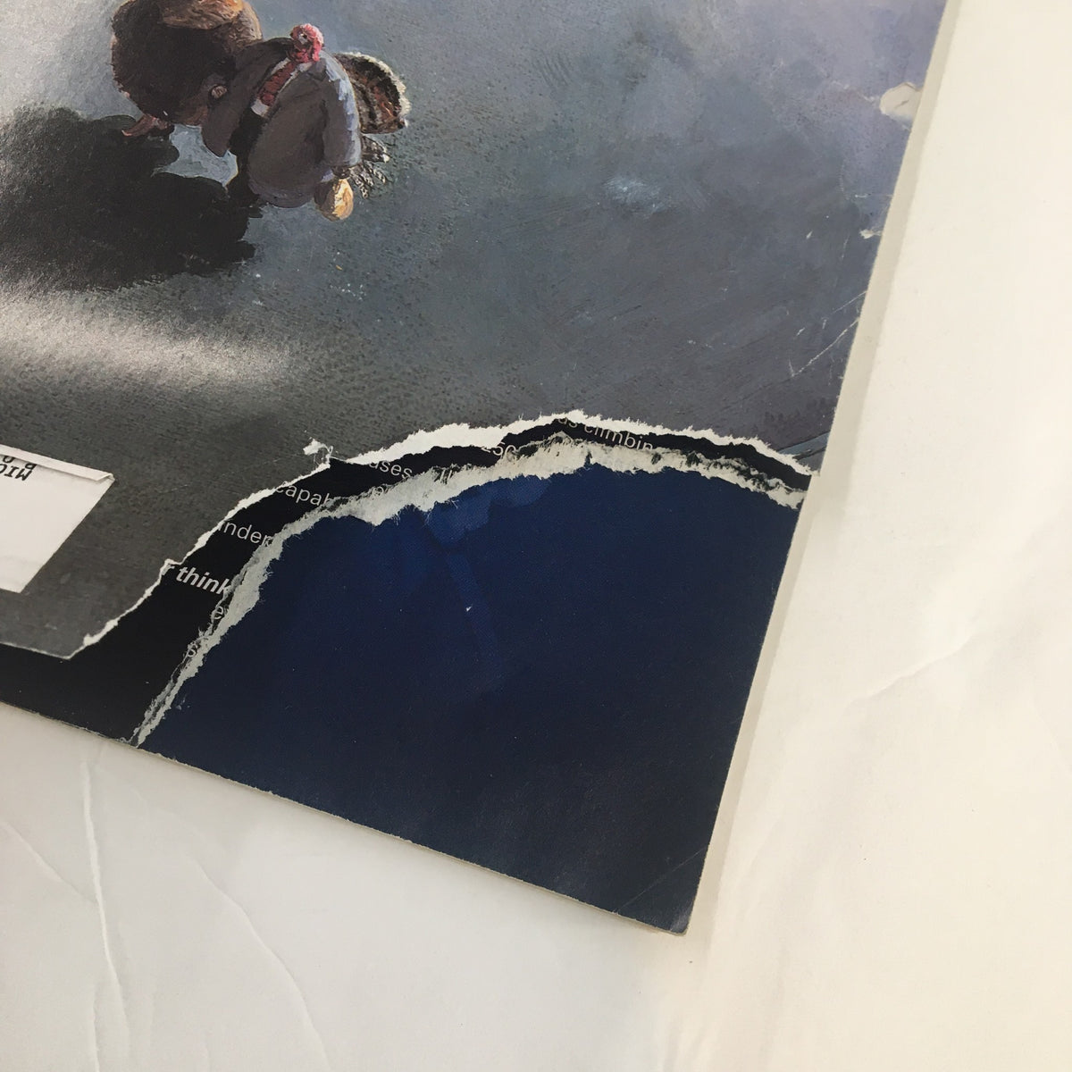 Close-up view of the cover corner of The New Yorker Full Magazine December 2, 2002, highlighting wear and tear with a blue background, part of the iconic 'Last-Minute Errand' artwork.