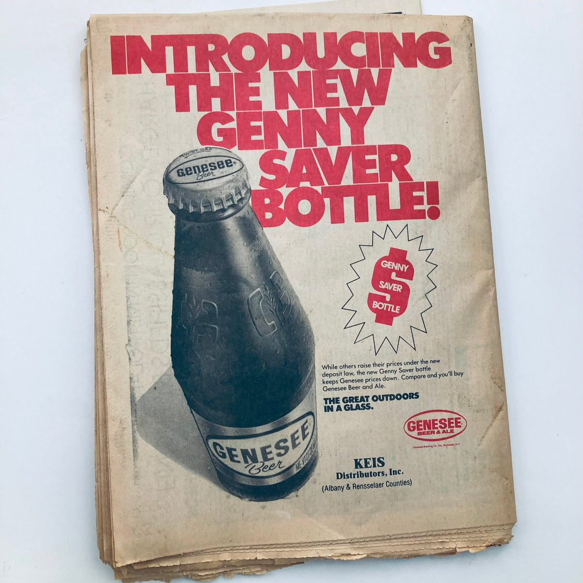 Vintage advertisement from the VTG Metroland Newspaper September 22 1983 introducing the new Genny Saver Bottle, prominently displaying product information and branding.