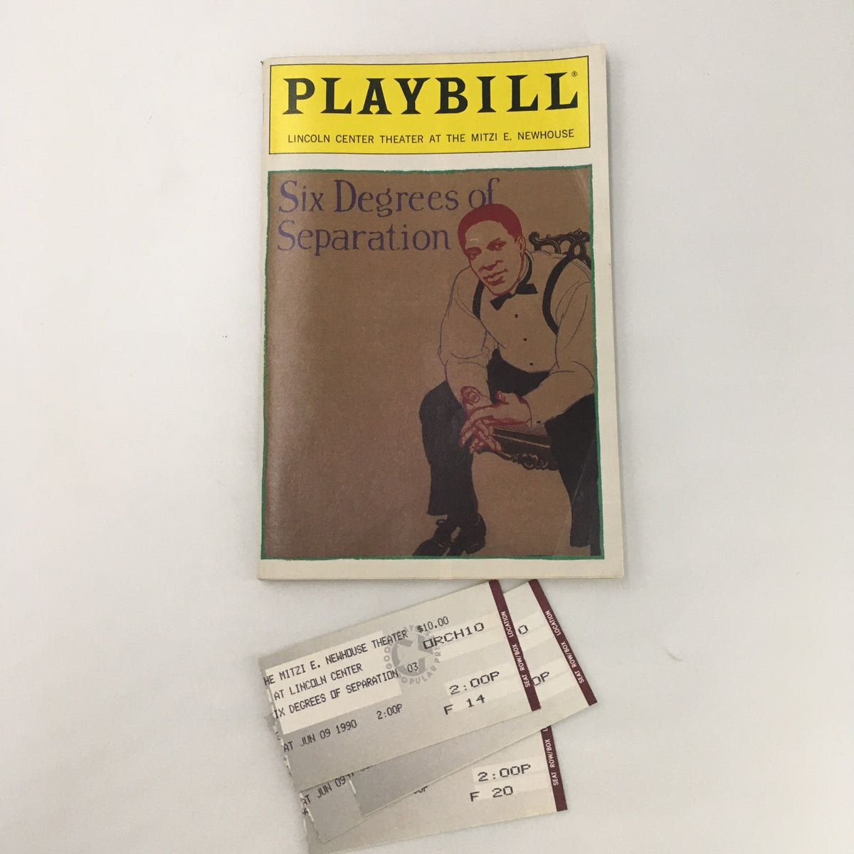 1990 Playbill for 'Six Degrees of Separation' by John Guare alongside original tickets, depicting a collectible item from the Mitzi E. Newhouse Theater.