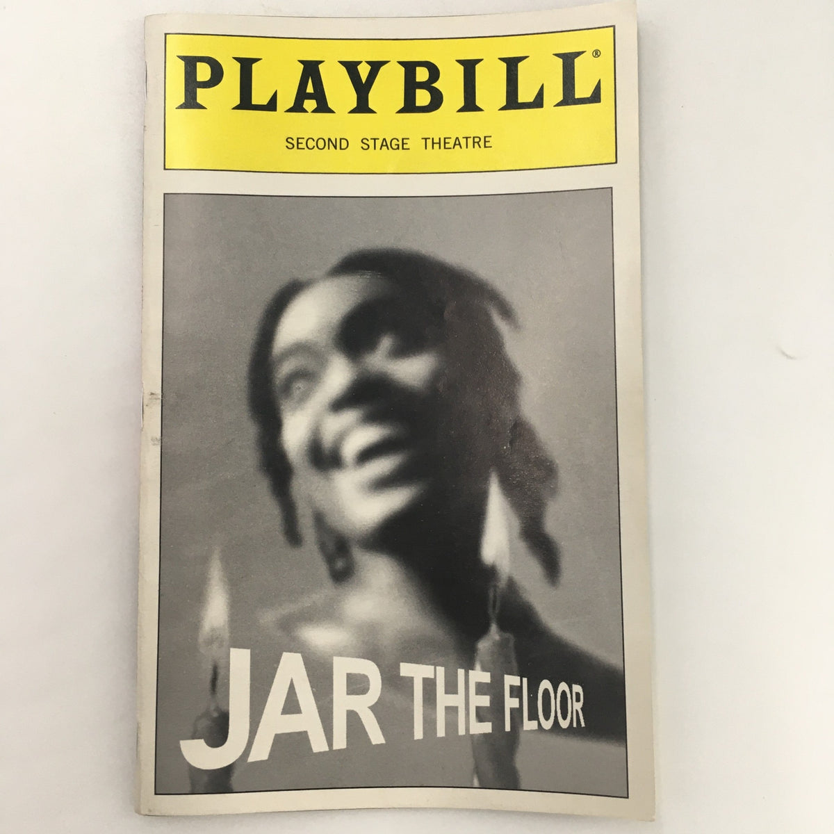 1999 Playbill for 'Jar the Floor' featuring a smiling actress on the cover from the Second Stage Theatre.