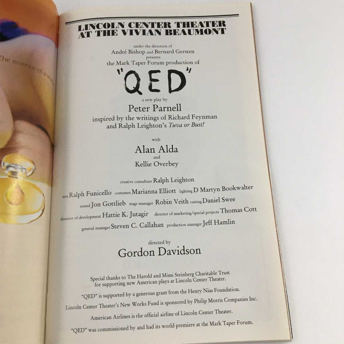 Cover page of the 2001 Playbill for QED by Peter Parnell at Lincoln Center Theater, showcasing the title and artistic presentation.