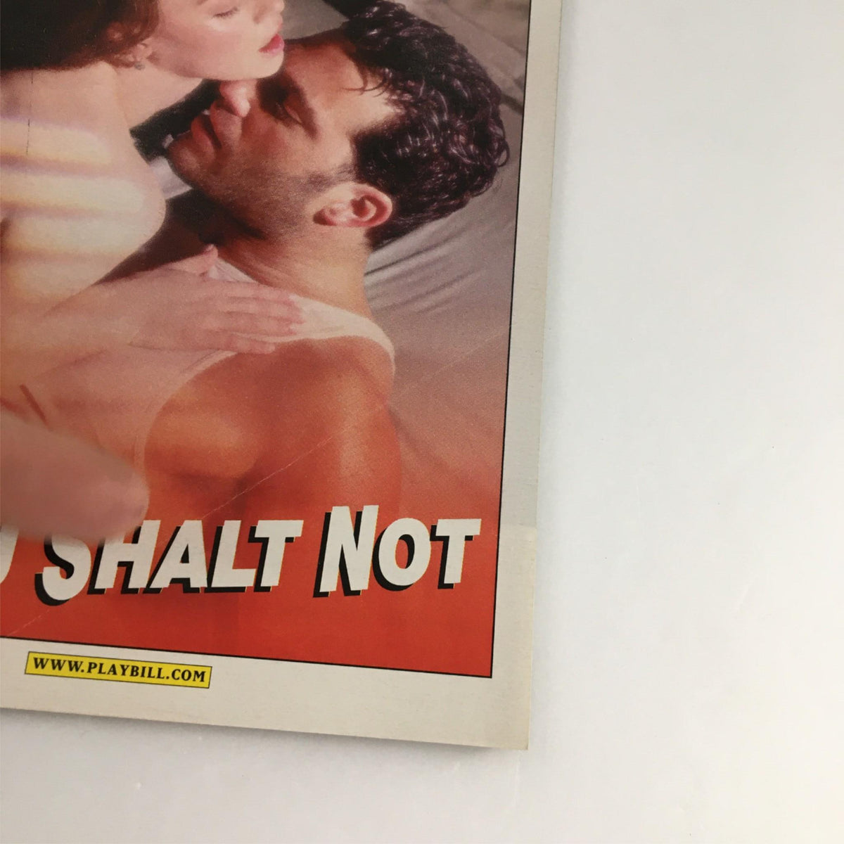 2001 Playbill for 'Thou Shall Not' featuring a close-up image of a couple on the cover, representing the theatrical production staged at Plymouth Theater.