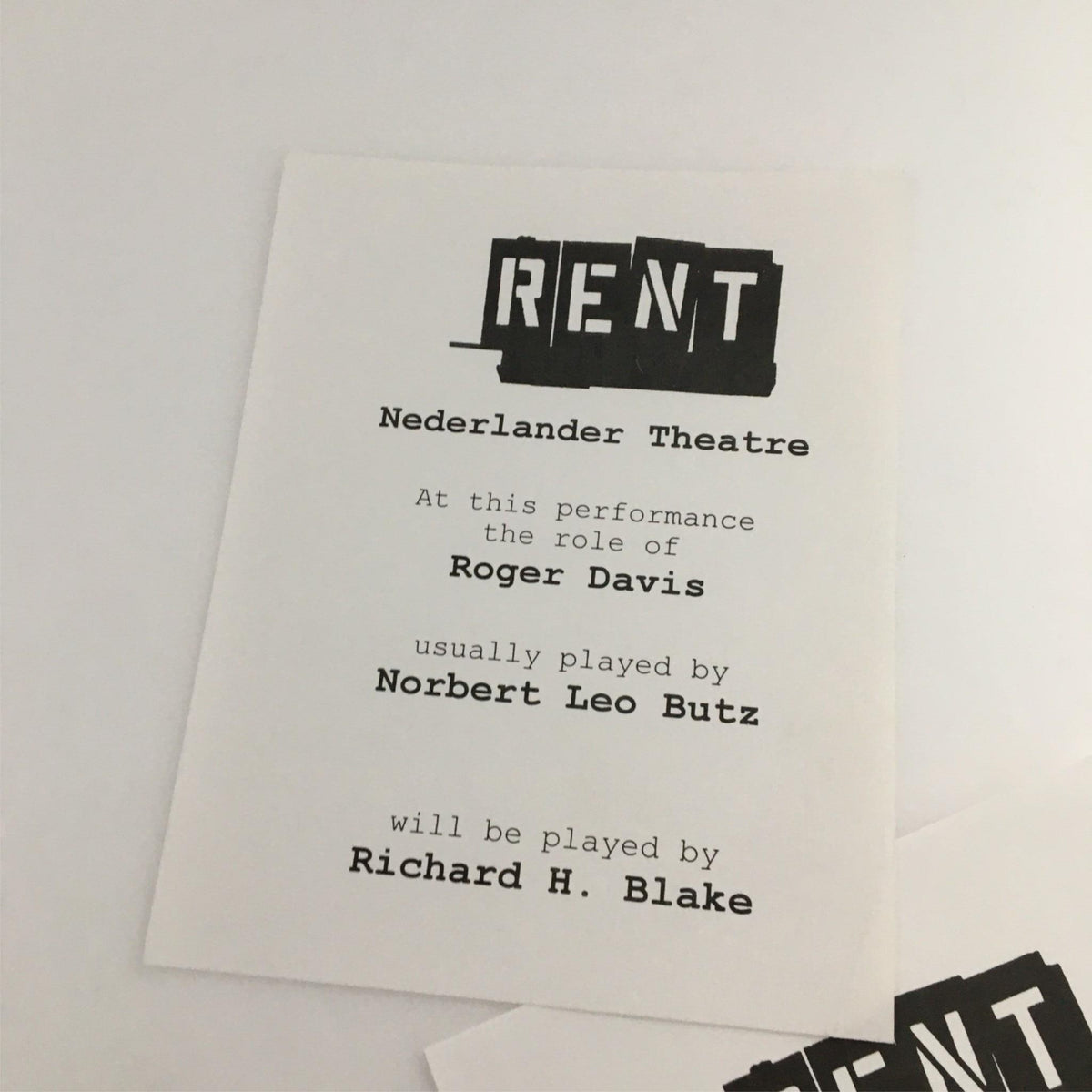 Program card from the 1998 Playbill Rent at Nederlander Theatre, detailing the performance of Richard H. Blake as Roger Davis, highlighting the cast's roles.
