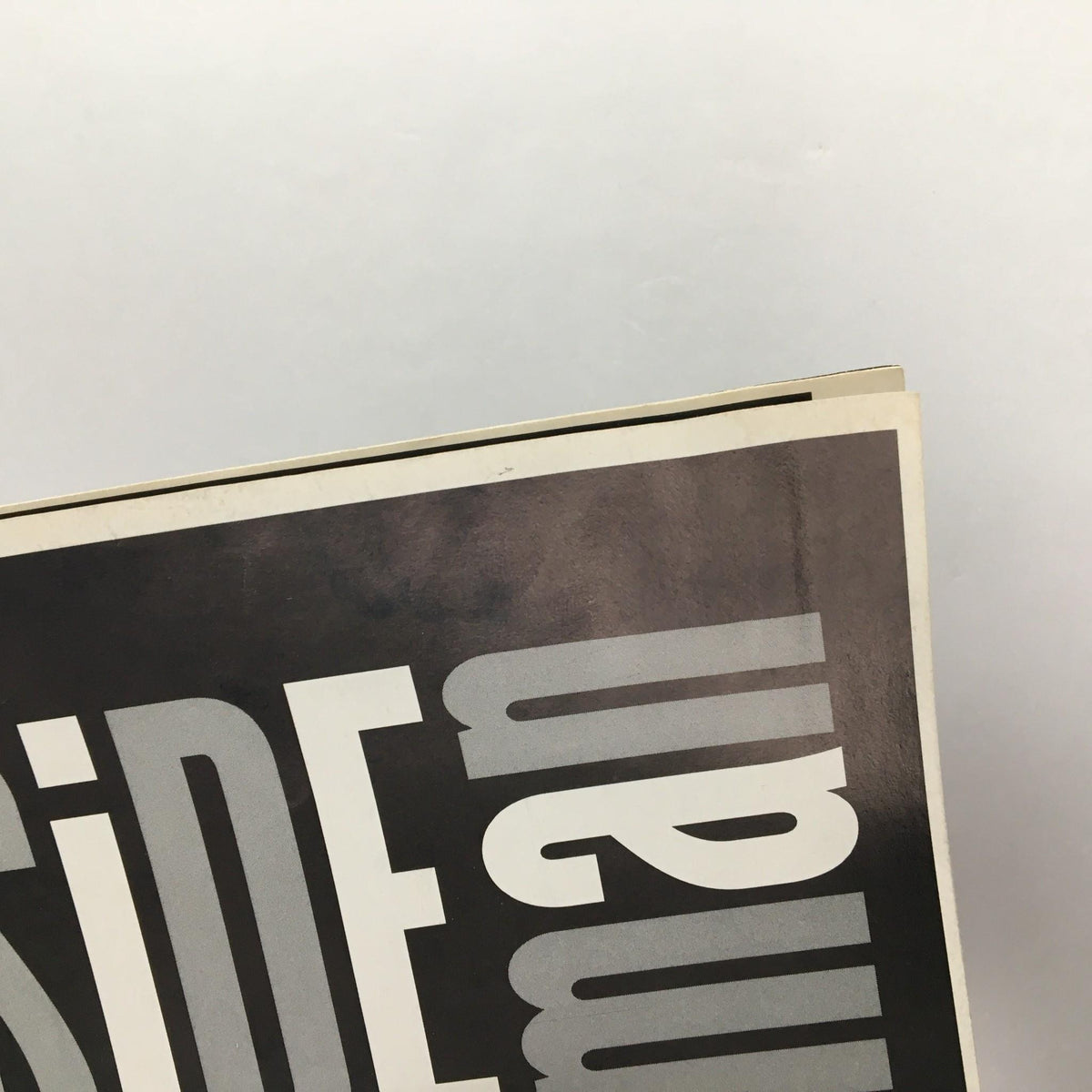 Close-up of the top spine of the 1999 'Side Man' Playbill, illustrating the wear and character of this collectible theater program.