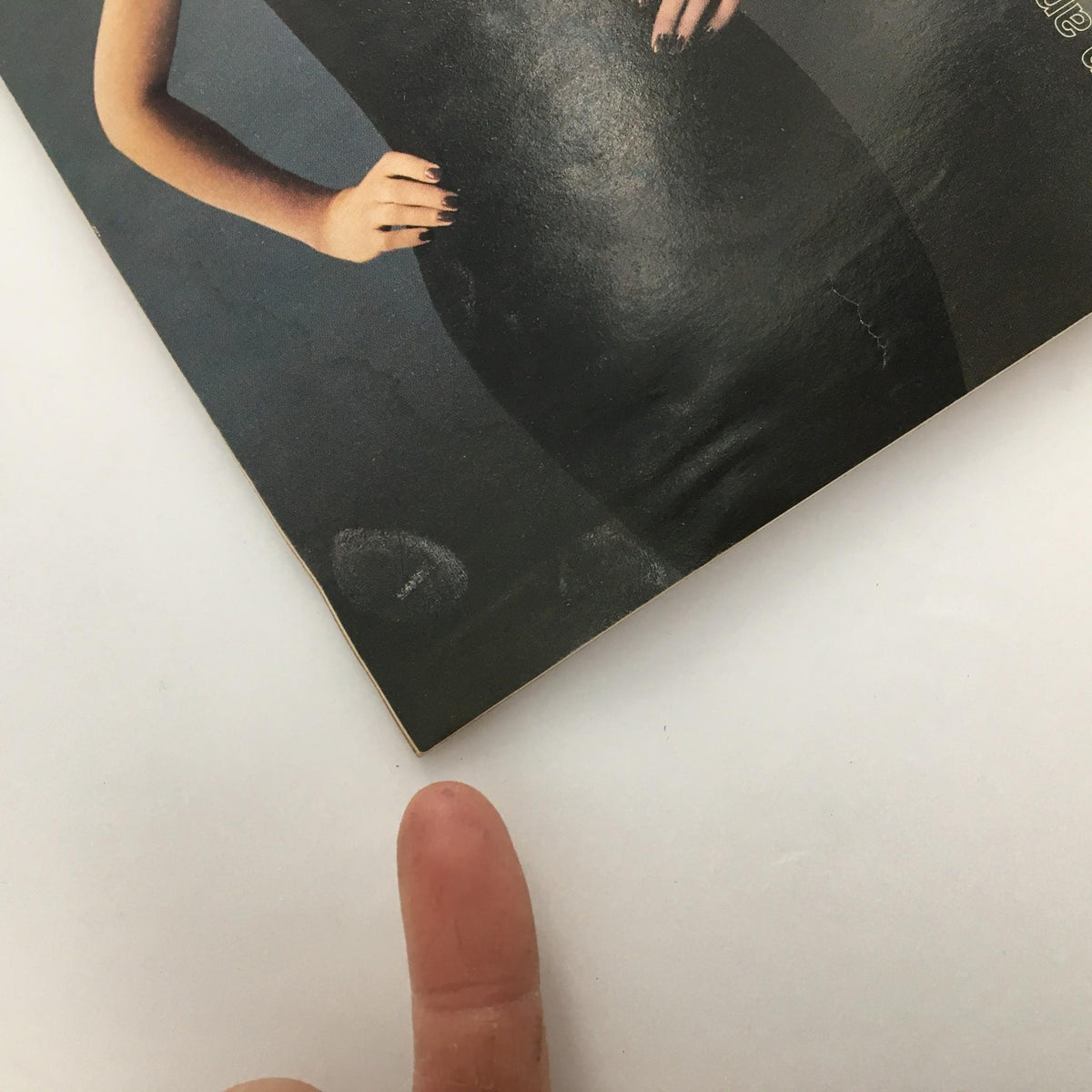 Detailed view of the corner of the 1999 'Side Man' Playbill, highlighting minor imperfections, showing its authentic vintage condition.