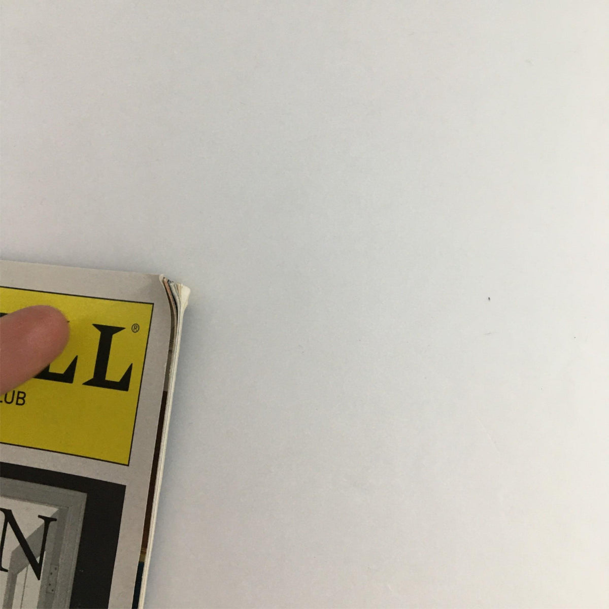 Close-up view of the corner of the 2002 Playbill for Garden by Manhattan Theater Club, showcasing minor wear and tear.