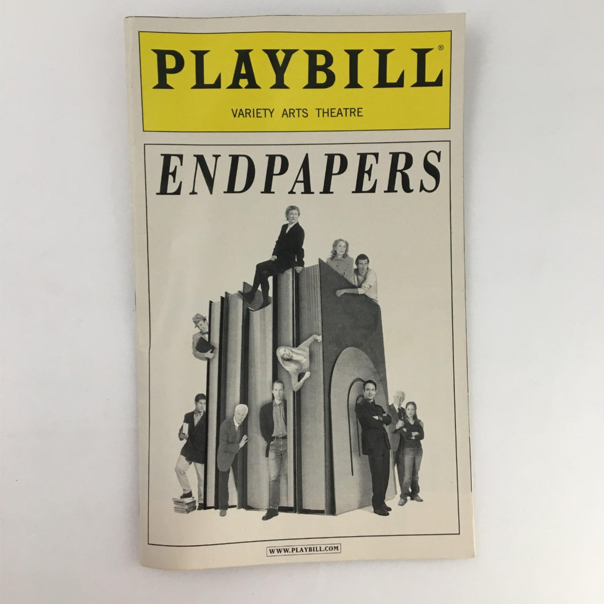 Front cover of the 2002 Playbill Endpapers by Variety Arts Theatre, showcasing the title with performers atop abstract sculptures.