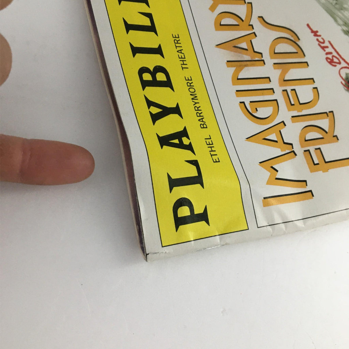 Close-up of the 2002 Playbill for Imaginary Friends showcasing the title and theatre details.