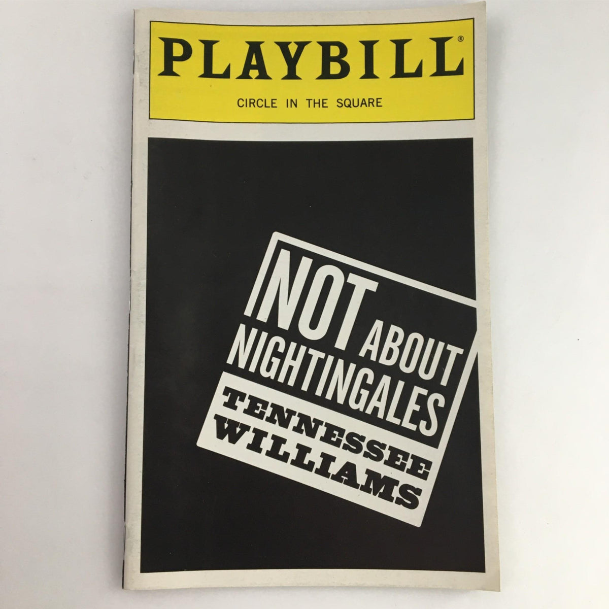 1999 Playbill for Not About Nightingales by Tennessee Williams, featuring a striking black cover with bold white and yellow lettering, produced by Circle in the Square Theatre.