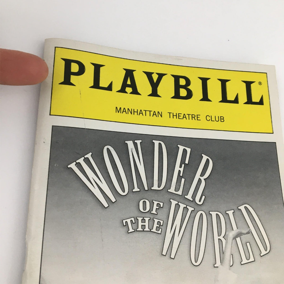 Top view of the 2001 Playbill for 'Wonder of the World' by Manhattan Theatre Club, highlighting the title and theater name.
