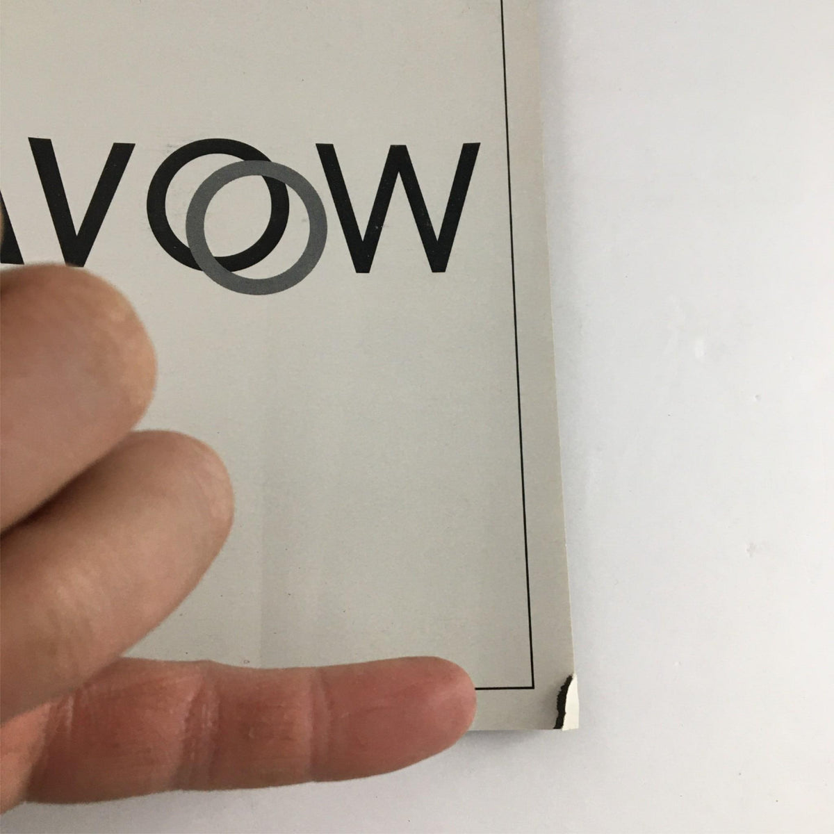 Close-up of the 2000 Playbill Avow showing minor damage at the corner, highlighting its collectible nature.