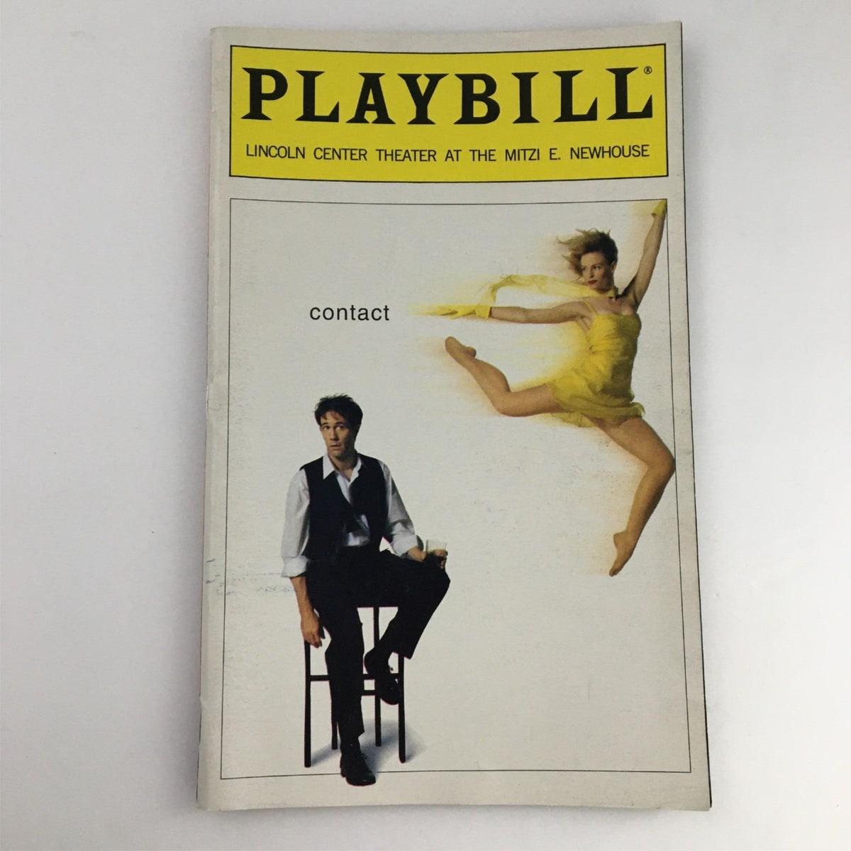 1999 Playbill for the production 'Contact' by Lincoln Center Theater at the Mitzi E. Newhouse, featuring a dancer in a yellow dress and a seated actor.